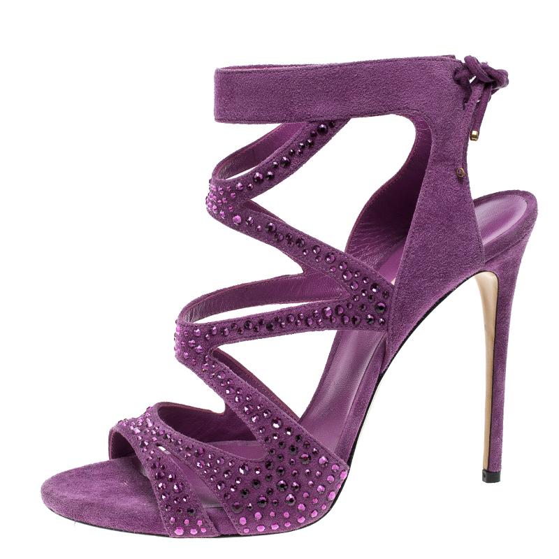 Casadei creates the perfect balance of casual chic and glamorous in this pair of crystal embellished pumps. Crafted from suede for a comfortable fit, these cut out body of these shoes are glammed up with crystals all over the body as they stand on