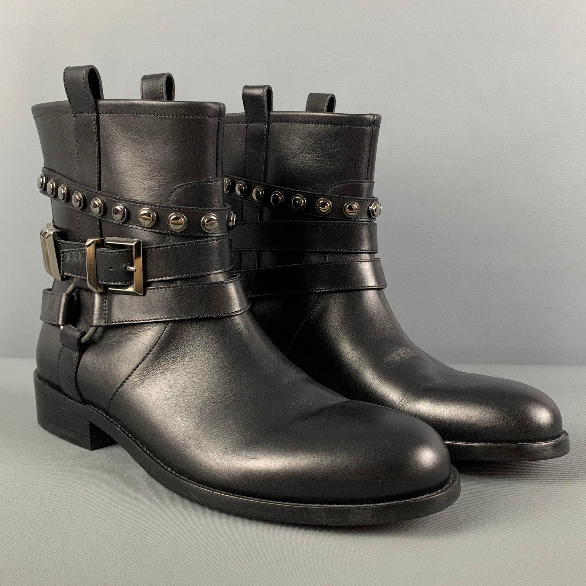 CASADEI boots comes in a black leather featuring silver tone hardware, multi strap design, pull on style, and a chunky heel. Made in Italy.
Excellent
Pre-Owned Condition. 

Marked:   42.5 

Measurements: 
  Length: 11.75 inches Width: 4.25 inches
