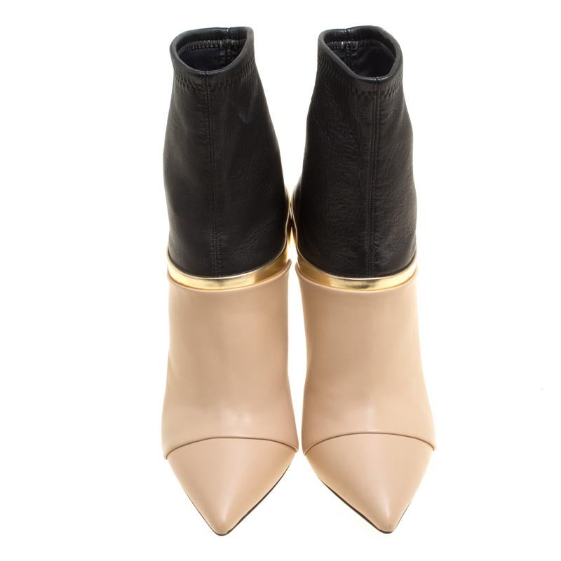 These tricolour boots from Casadei are perfect for the smart, suave and stylish women. Crafted from leather, these ankle boots feature pointed toes, comfortable leather lined insoles, and 10.5 cm stiletto heels. This pair is absolutely worth every