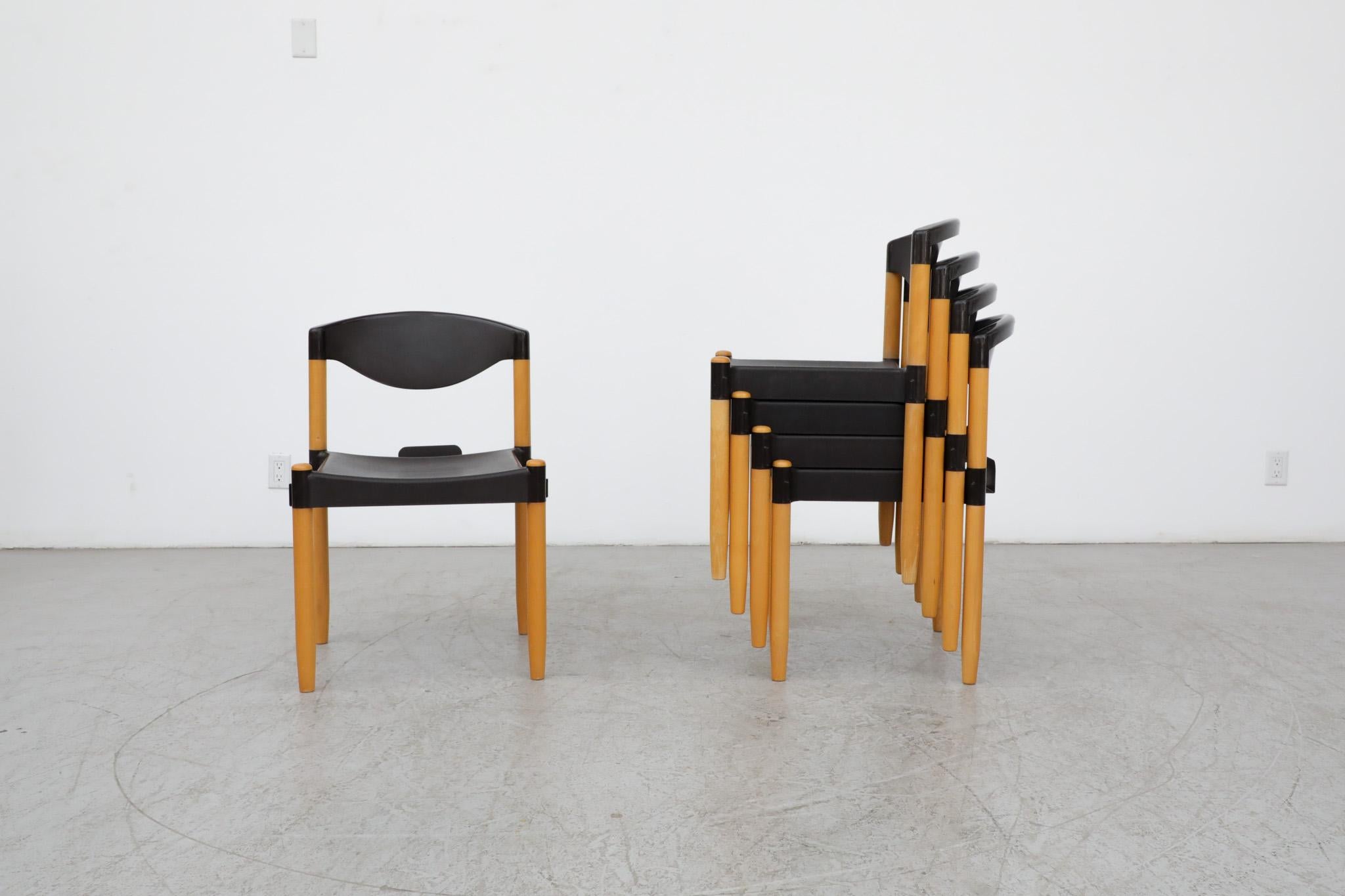 Mid-Century 'Strax' stacking chairs by Hartmut Lohmeyer for Casala, 1970s. Molded black plastic seat and back rest with tapered Birch legs designed to stack and interlock to make rows of seating. In original condition with visible wear and