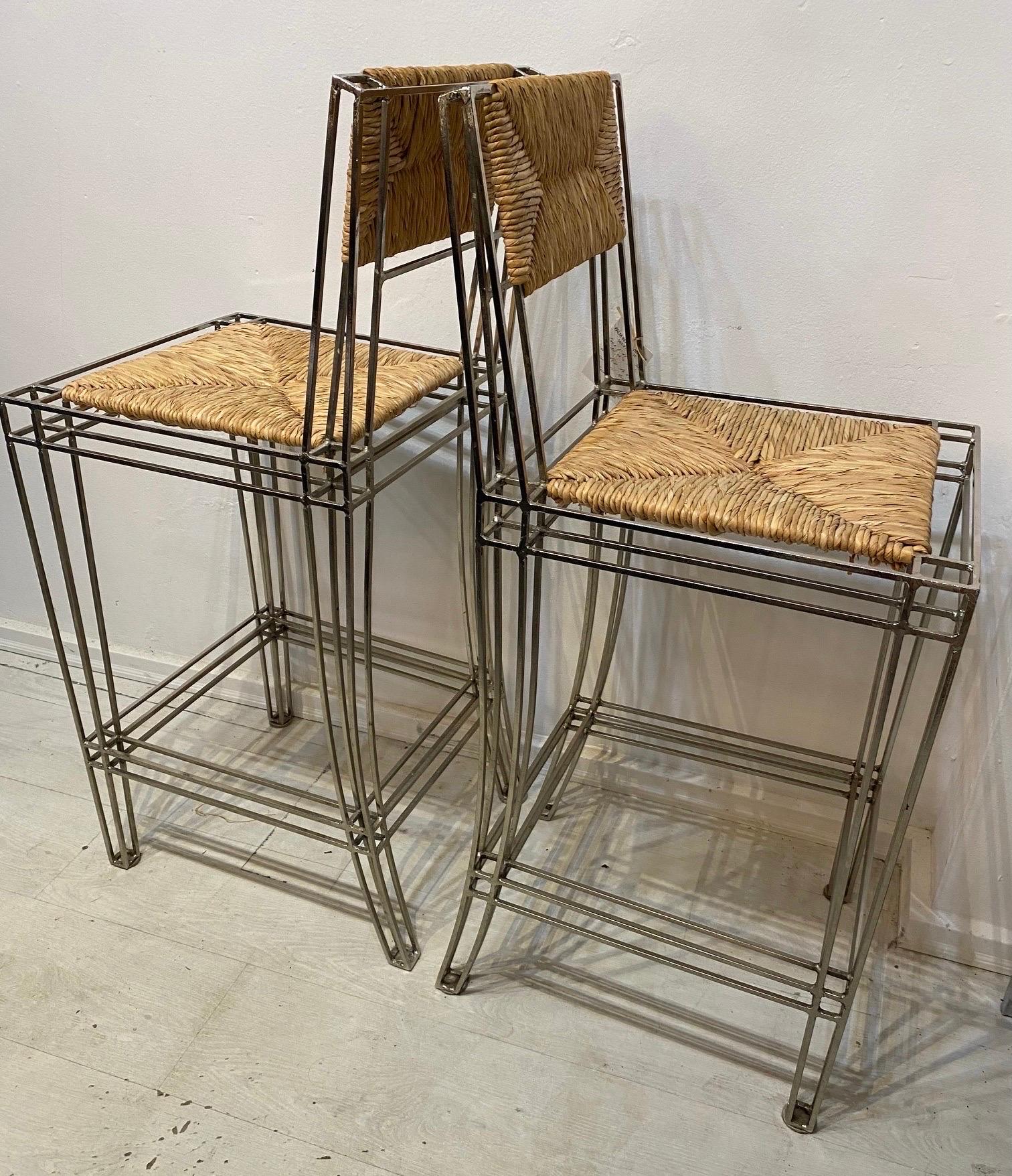Eight barstools made by Casamidy circa 2015. The barstools are nickel plated steel with Rush seat and rush back.. the rush and the nickel plated frames are very good.