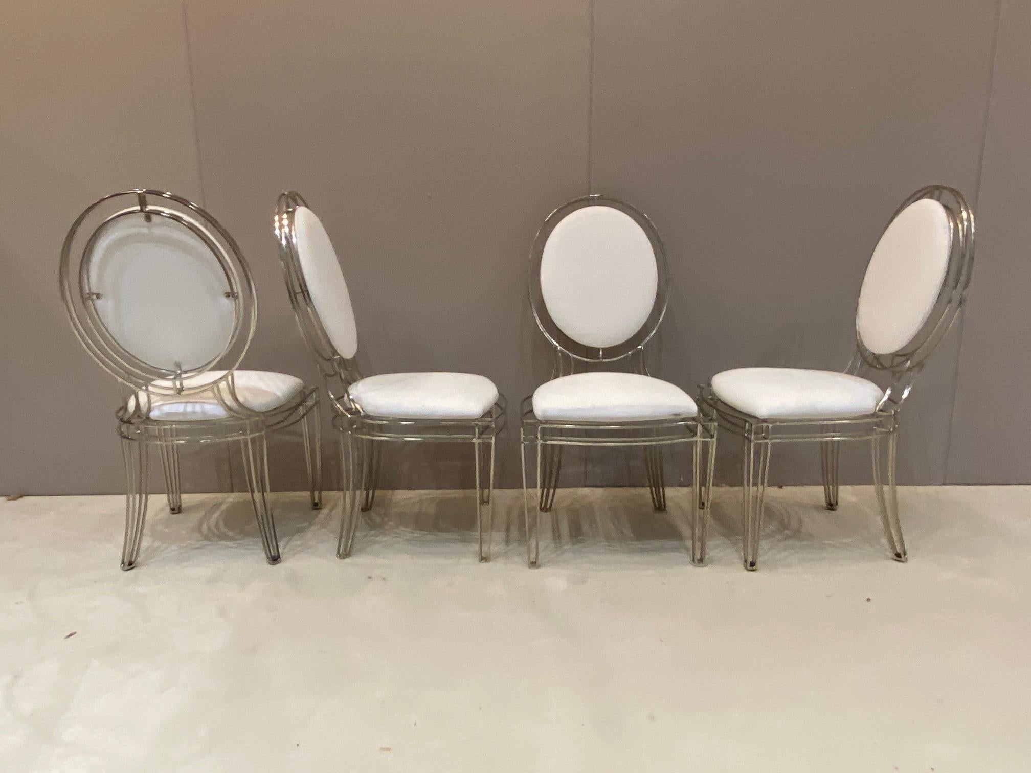 22 Of these chairs are available. They are nickel plated steel in good condition. The nickel plating on these chairs is done superbly. The construction is first class. Chair height 39 inches, widest point is seat 19.75 inches, seat height 18 inches,