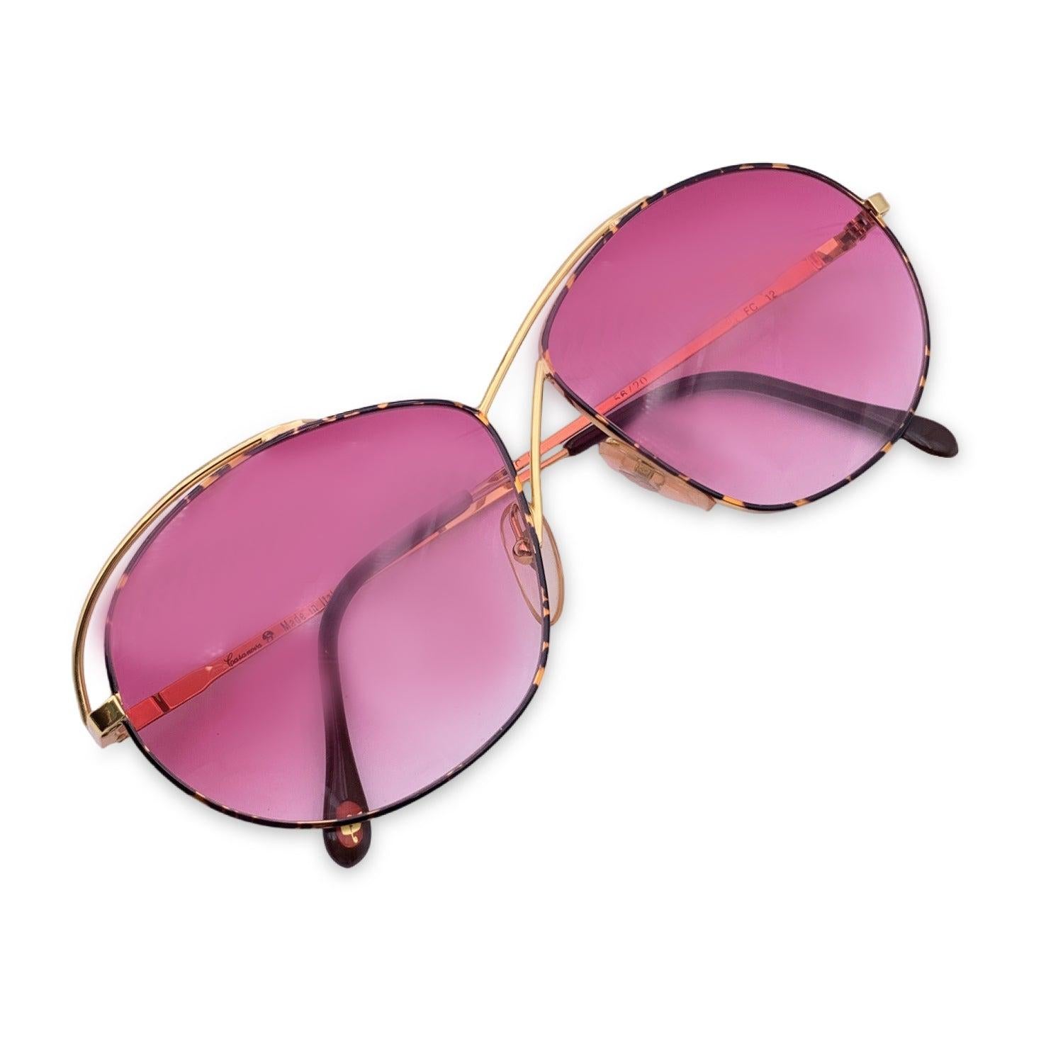 Vintage Casanova Butterfly Women sunglasses. Model C 02. Size: 56/20 130mm. Brown tortoise metal frame with two gold metal lines over the bridge and over the temples. Gold Plated (24K). 100% Total UVA/UVB protection. Gradient pink lenses. Made in
