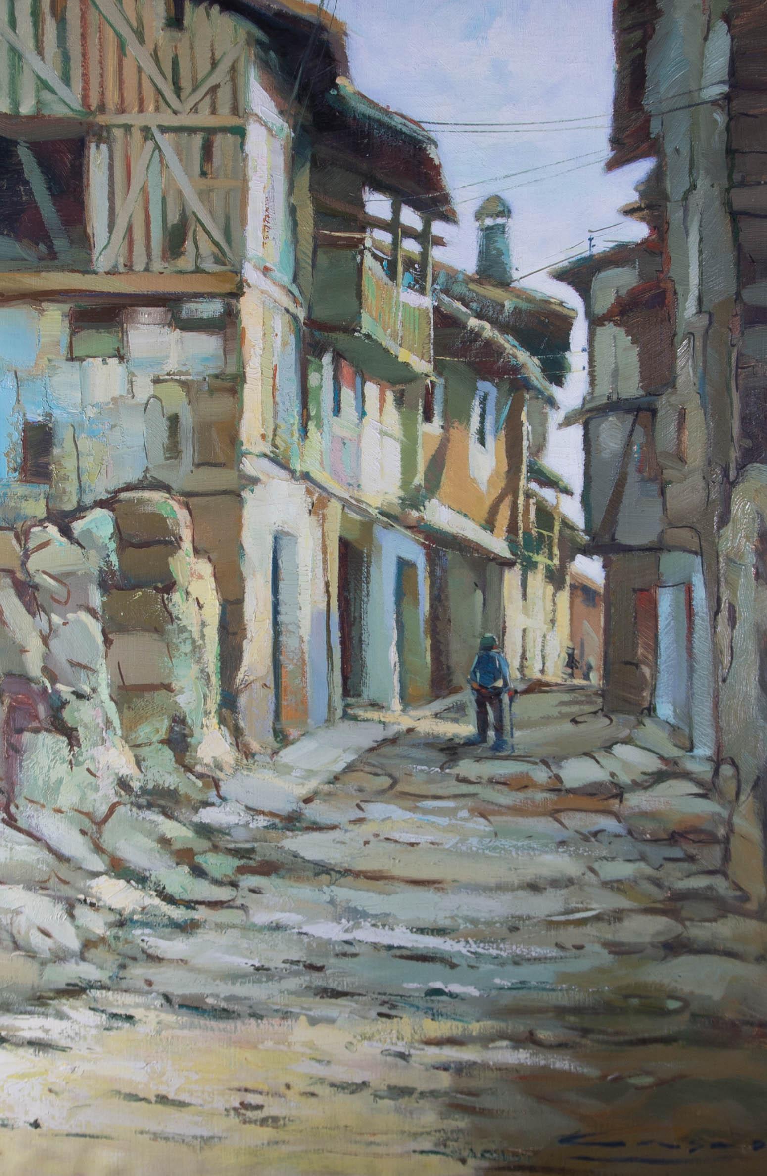 A rustic contemporary oil showing a cobbled Italian street with a figure strolling along the sun dappled path. The artist has signed to the lower right corner and the painting is presented in a contemporary gilt effect frame. On canvas.
