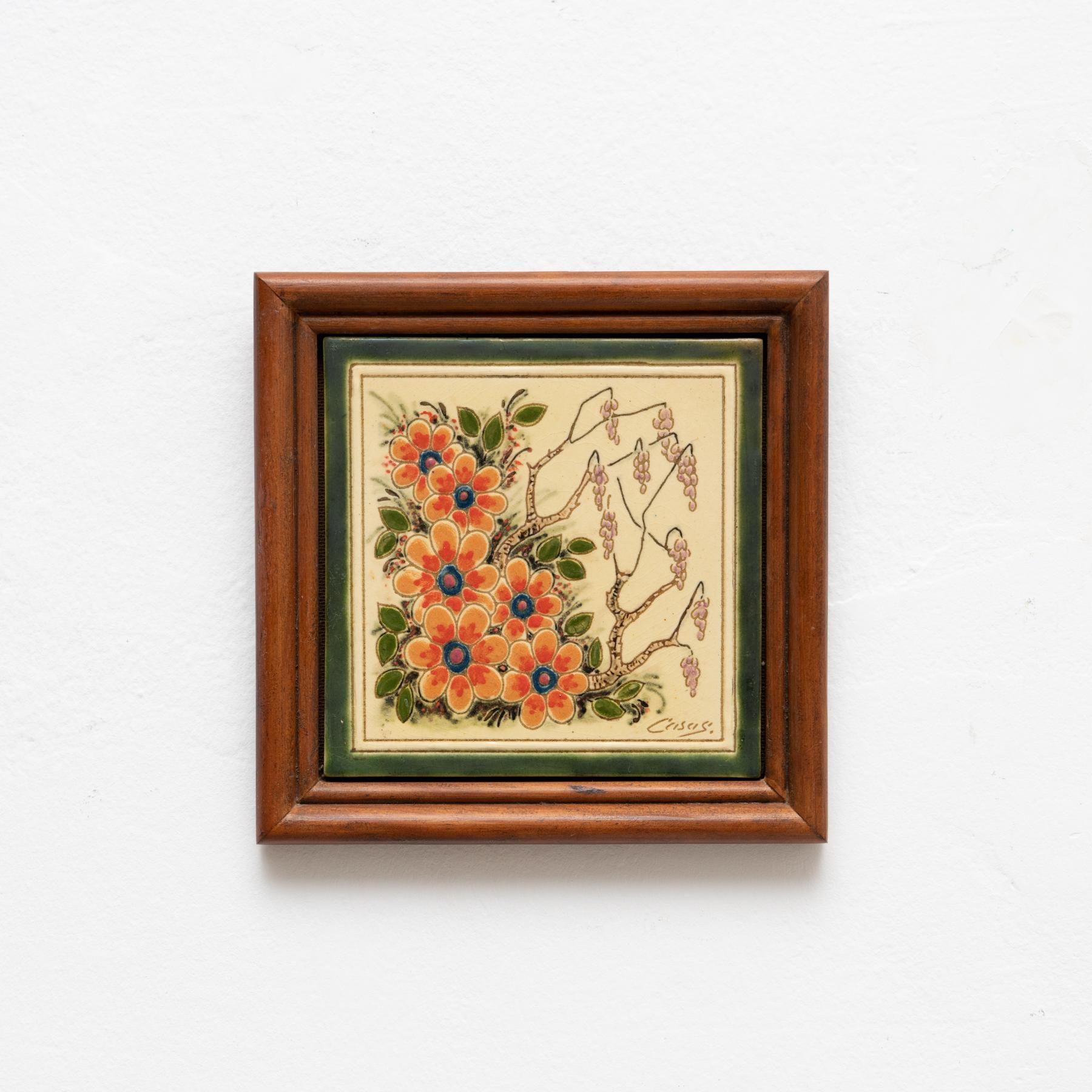 Ceramic hand painted floral artwork by Catalan artist Casas, circa 1960. Framed. Signed.  In original condition, with minor wear consistent of age and use, preserving a beautiul patina.