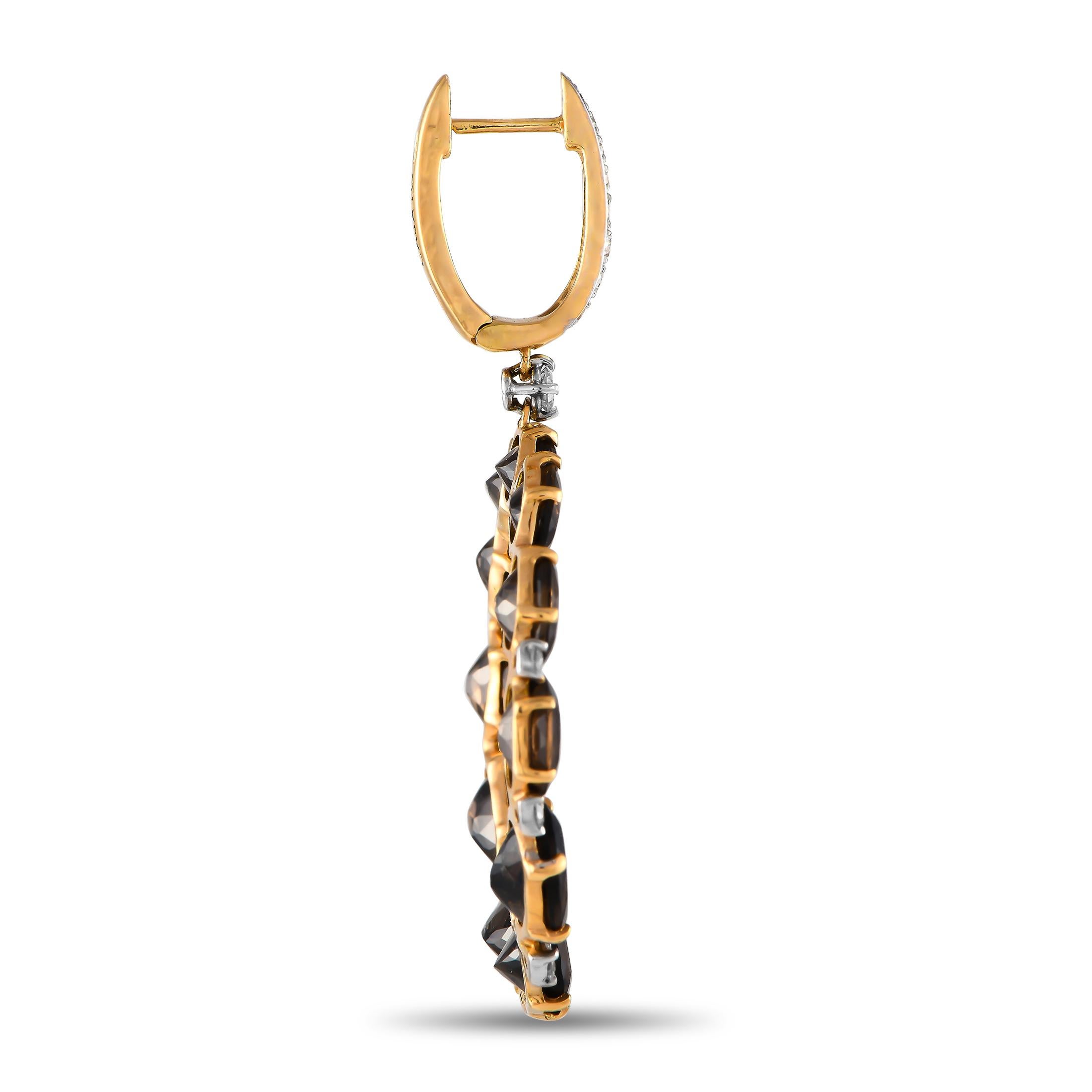 These Casato earrings are incredibly dramatic. On these impressive accessories, a series of smoky quartz gemstones in a circular arrangement are beautifully juxtaposed with sparkling diamond accents totaling 0.60 carats. Crafted from 18K yellow
