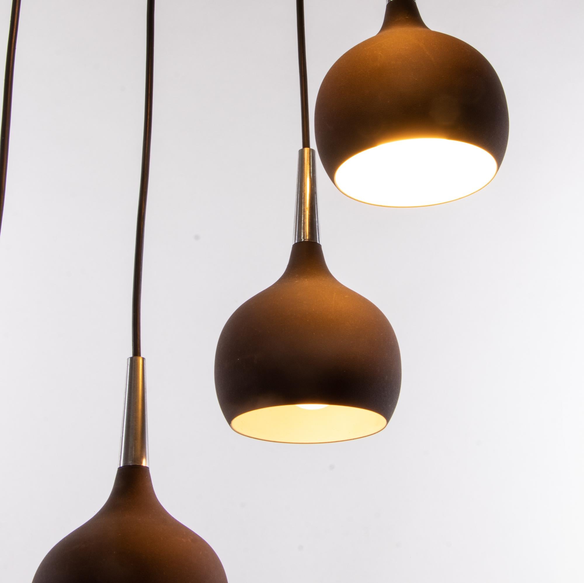 Elegant dome pendant light with seven drop-shaped shades in dark-brown metal with chromed brass mounting. With this light you make a clear statement in your interior design. A real eye-catcher even unlit. Designed by Hans-Agne Jakobsson (1919-2009)