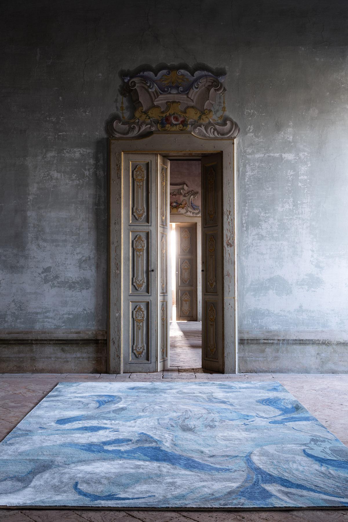 Inspired by the beautiful Nepalese skyscape where our rugs are made, Castro Smith evokes his iconic and whimsical engraving skills to create an ever-evolving design. Handcrafted in a fusion of wool and silk, the lustrous accents encourage the viewer