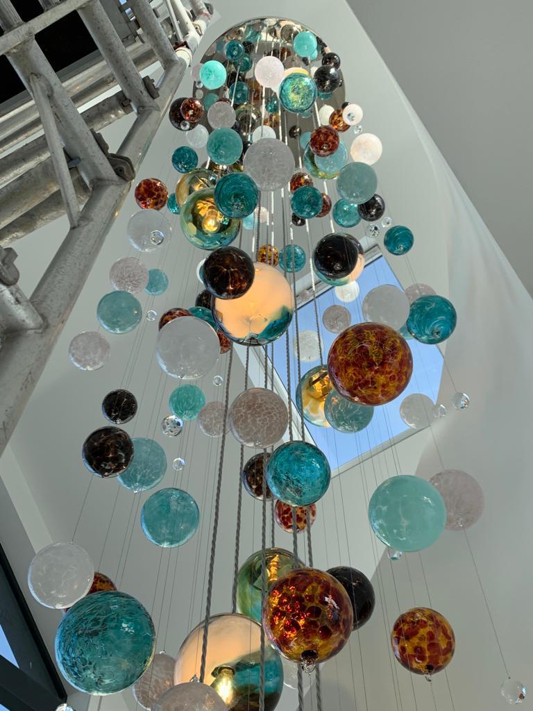 Modern Cascade Stairwell Chandelier by Roast Featuring Individually Blown Glass Spheres For Sale