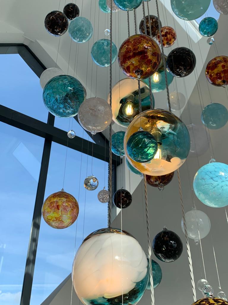 British Cascade Stairwell Chandelier by Roast Featuring Individually Blown Glass Spheres For Sale