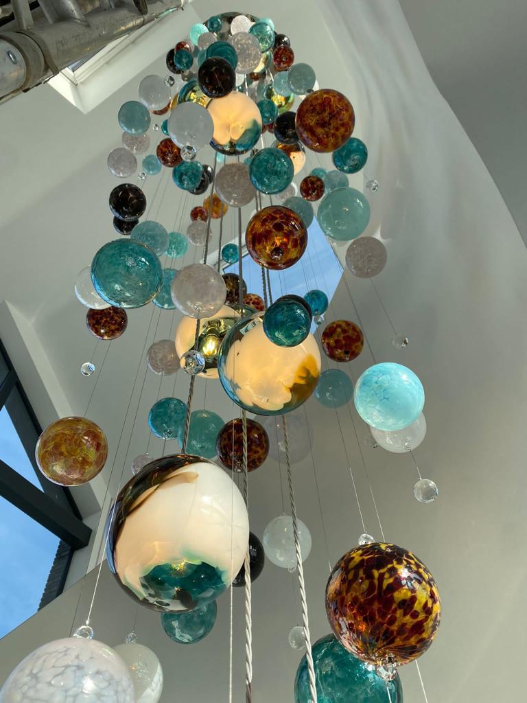 Hand-Crafted Cascade Stairwell Chandelier by Roast Featuring Individually Blown Glass Spheres For Sale