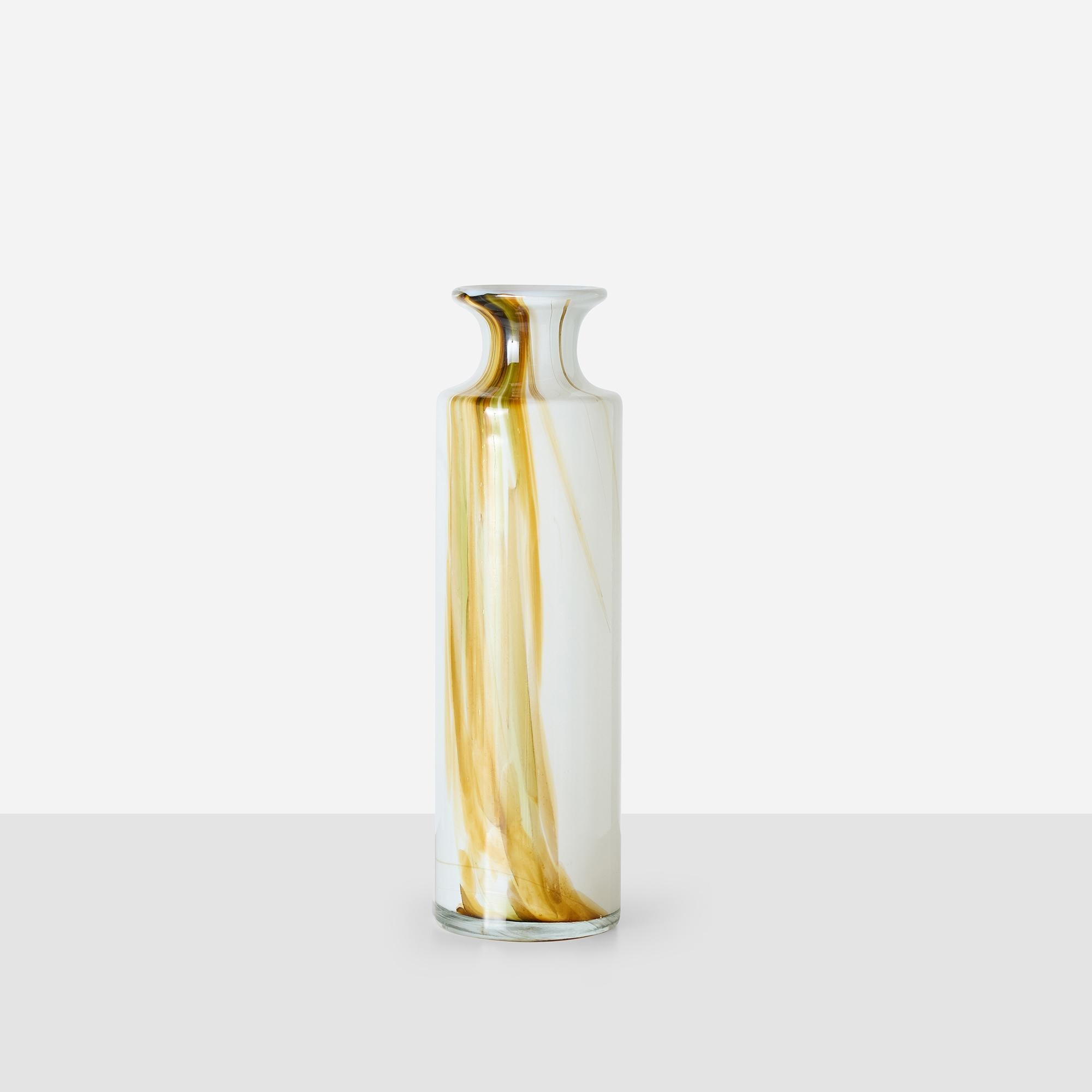 Cased opaline white glass with vertical amber and olive streaks from Per Lütken’s Cascade series for Holmegaard. Tall cylindrical form with flared rim, signature etched to base. Very good vintage condition, showing no chips or scratches.