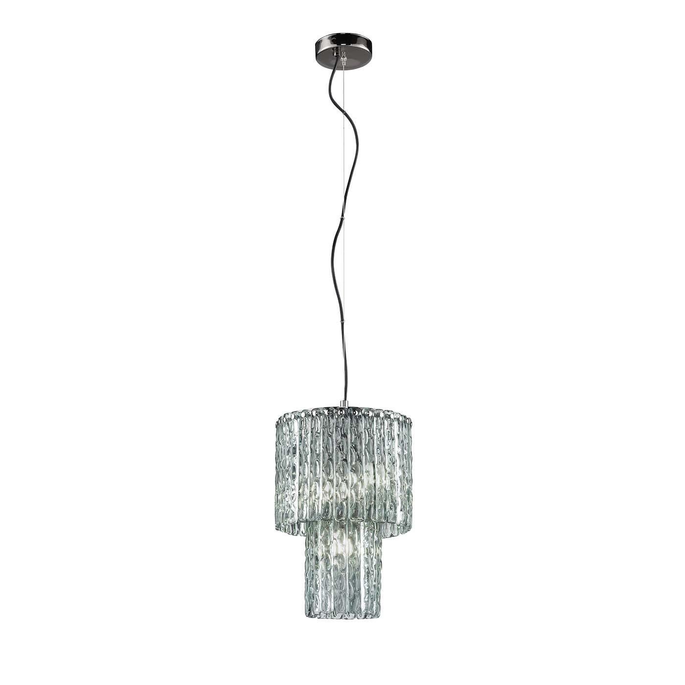 This elegant and stylish midcentury style chandelier is part of the Cascade Collection and features a round chrome-plated frame with two tiers of cascading rectangular pendants in hammered glass with an iridescent viridian color. Entirely
