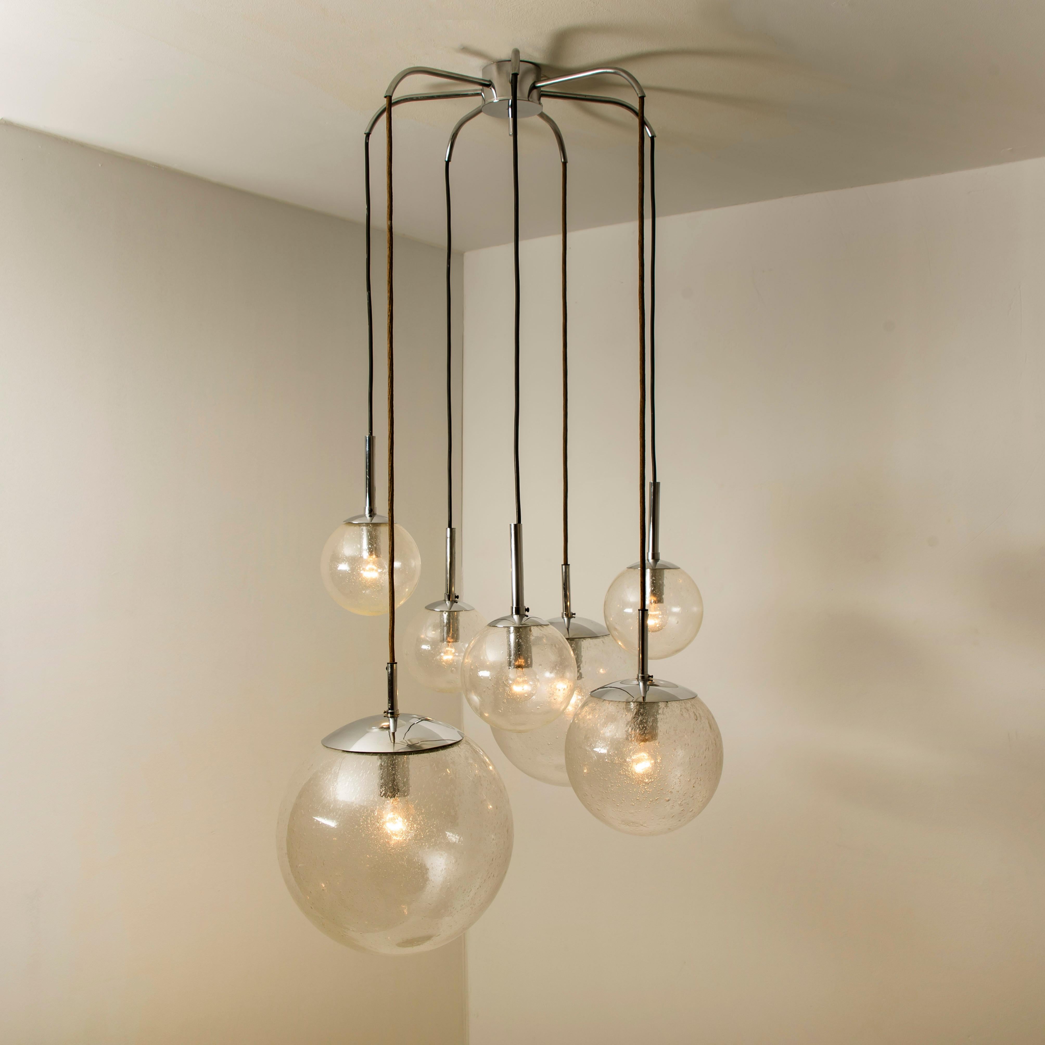 Absolutely amazing huge ceiling mount pendant light fixture with seven different sizes of globes or spheres by Limburg Glashütte. With hand blown glass pendants. Complete with a special new custom made ceiling plate for five globes. Very suitable