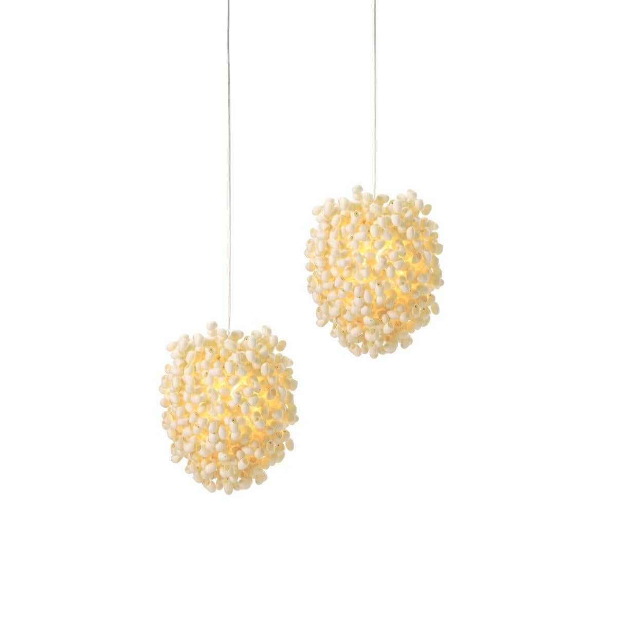 Cascadence ceiling light is uniquely created and handcrafted by Ango using individual hand-selected silk cocoons. The design continues Angos’ narrative of fusing nature and technology, with the diffuser in an ovoid form composed of natural silk