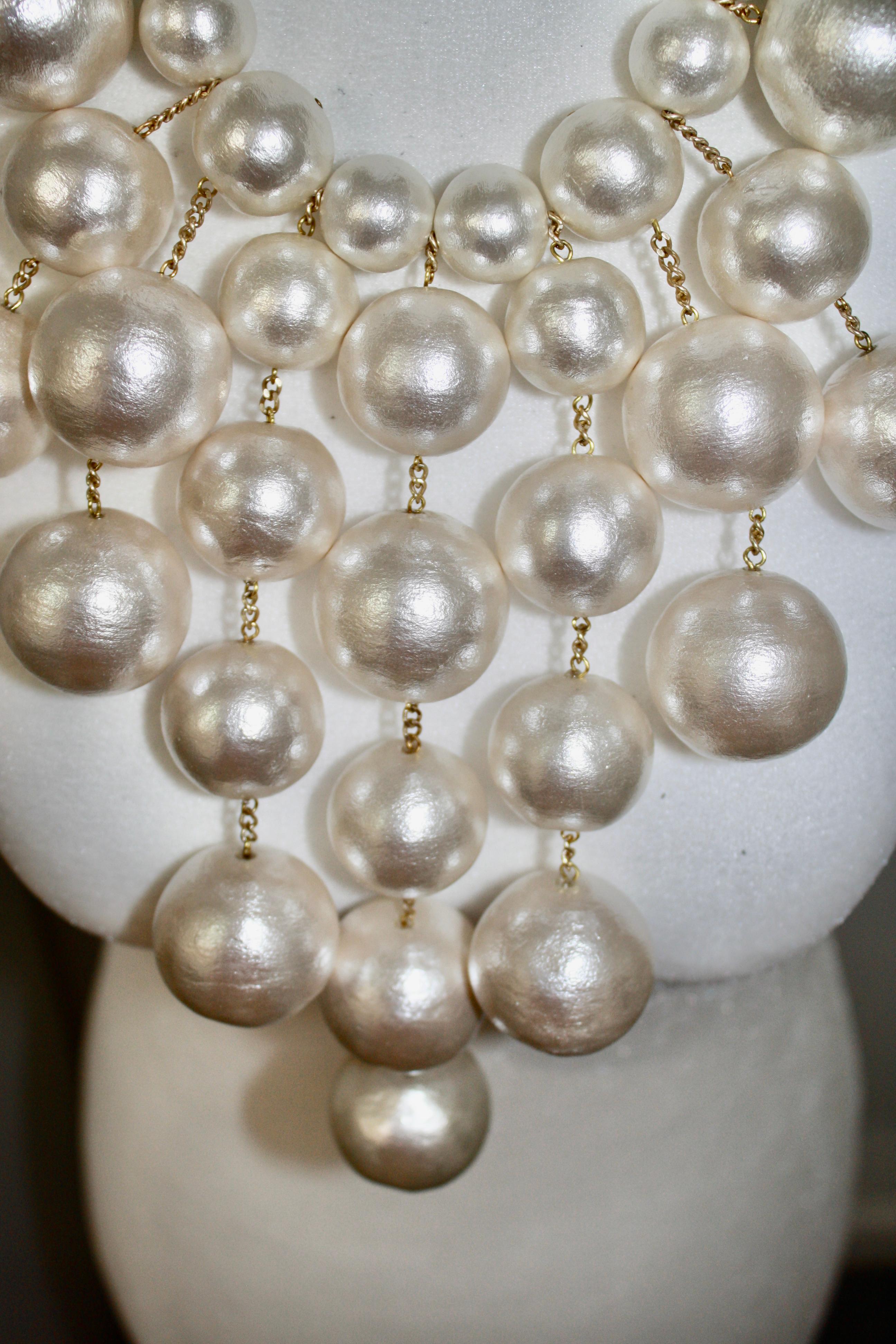 Super light cotton pearl with  gold metal chain and hook clasp . Adjustable length with 4 