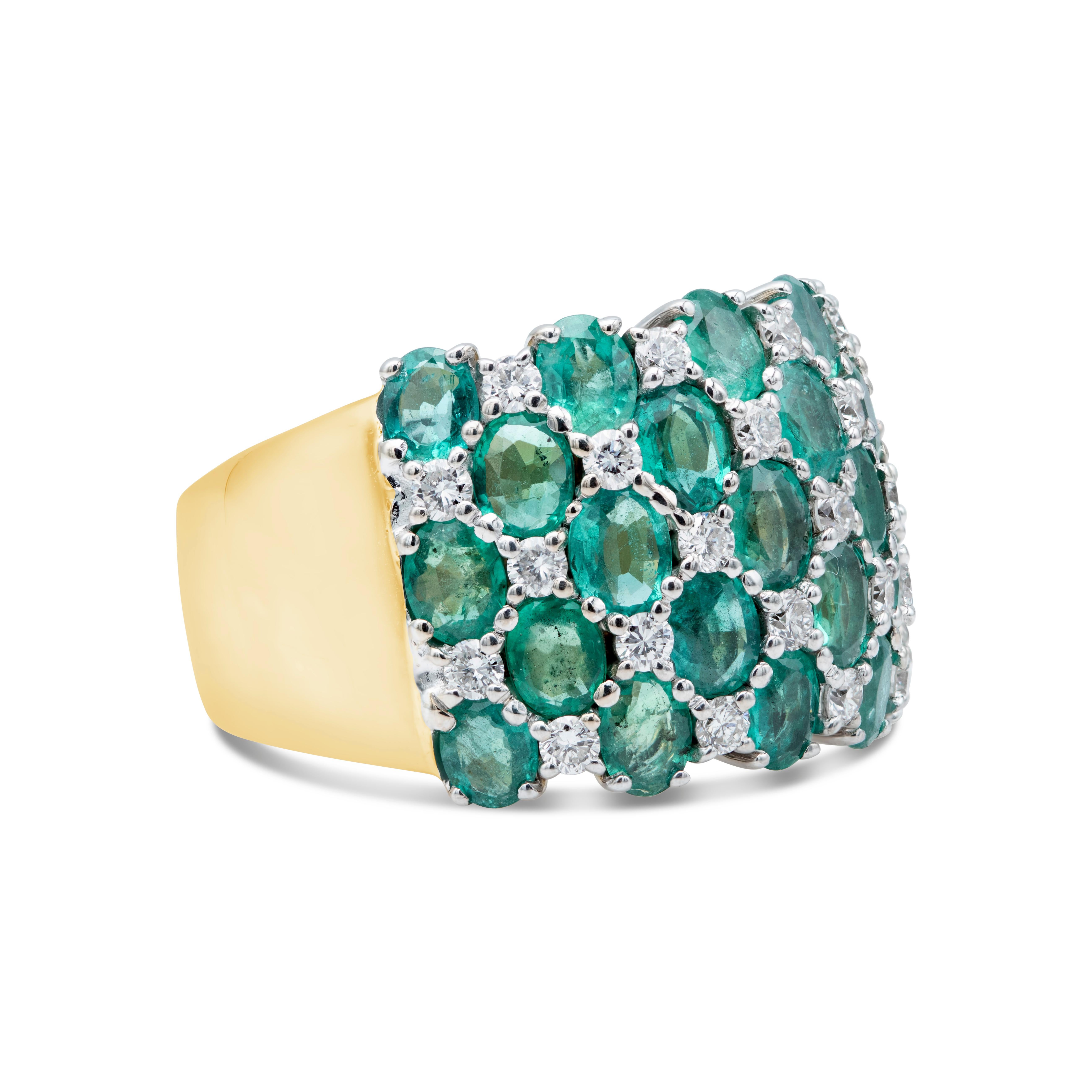 A chic and beautiful fashion ring features a cluster of oval cut green emeralds weighing 4.50 carats total. Accented with brilliant round diamonds weighing 0.55 carats. Made in 18K White and Yellow Gold. Size 9 US.

Style available in different