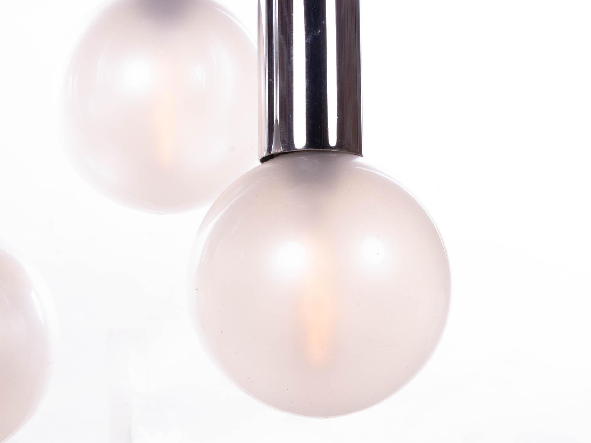 Elegant space age sputnik ceiling fixture with pearlized glass globes 'like bulbs' hanging on six chromed metal tubes. Chandelier illuminates beautifully and offers a lot of light. Designed by Motoko Ishii for Staff Lighting, Germany, 1970s.