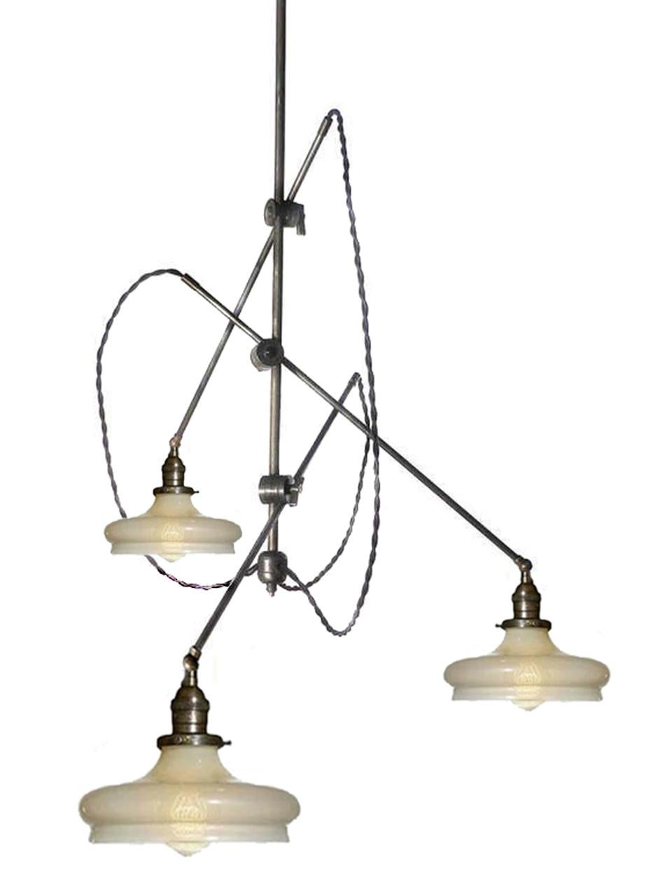 This perfectly sized articulated fixture features three matching Vaseline glass shades. The arms are all 36 inches long and the shades have 8.5 inch inch diameters. The vertical rod is 36 inches as well but can be longer if needed. The delicate