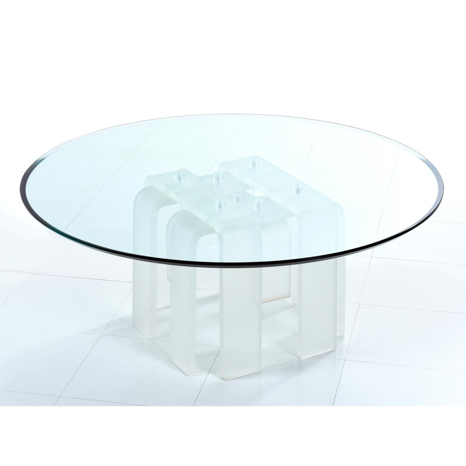 The arched legs of this 1970s frosted Lucite base evoke the beauty and serenity of a cascading waterfall. The glass top appears top float within the ethereal, translucent acrylic legs. Massive 1/2