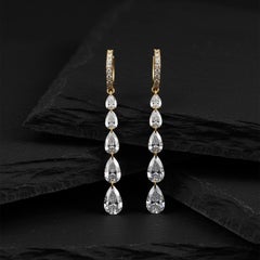 Boucles d
oreilles pendantes en or 14K (ou 18k sur demande) avec pavés en forme de poire en cascade
