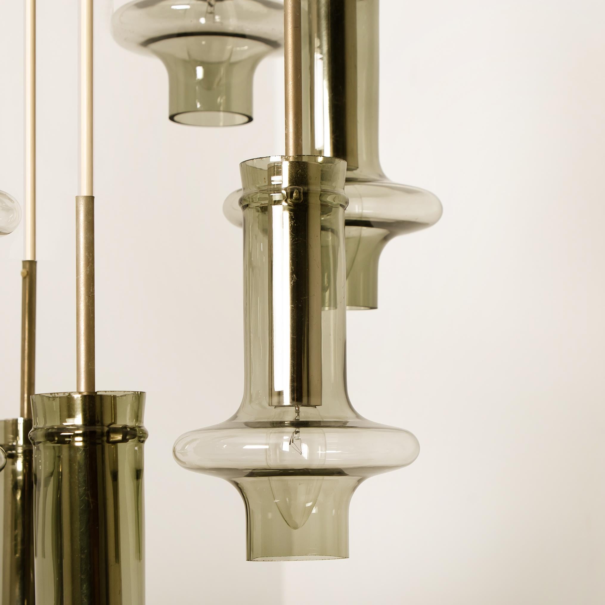 A beautiful and high quality seven-tier textured hand blown glass and chrome cascading chandelier, made in Austria in the early 1970s. With seven beautiful organic shaped hand blown glass tubes. Each tubes requires an Edison E27 screw on