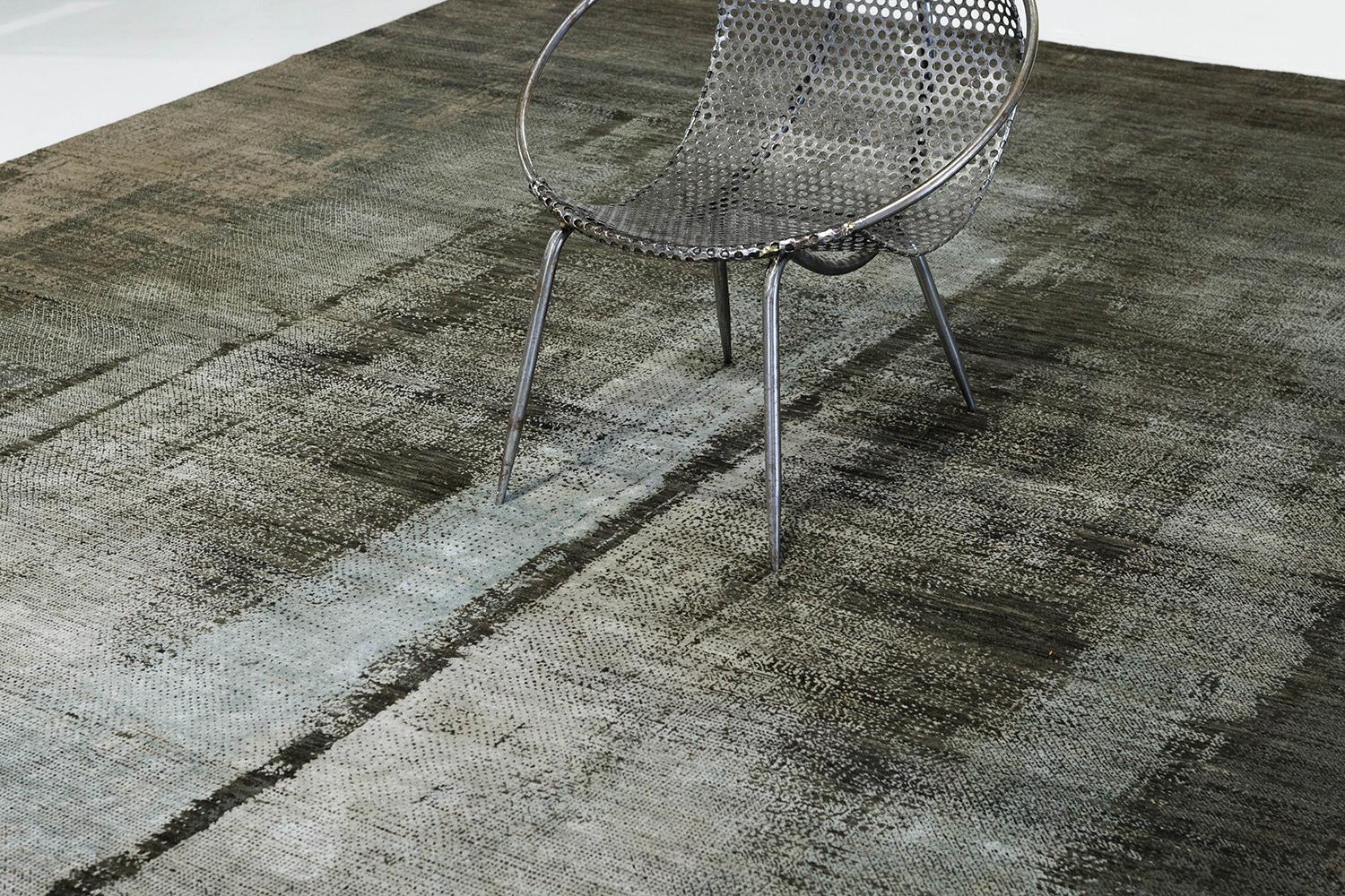 'Cascata' is the perfect contemporary piece weaving together both wool and silk. The cohesive colors of gray, coffee, and ice blue in addition to the rug's design that is made to look textured sure leaves lasting impressions.