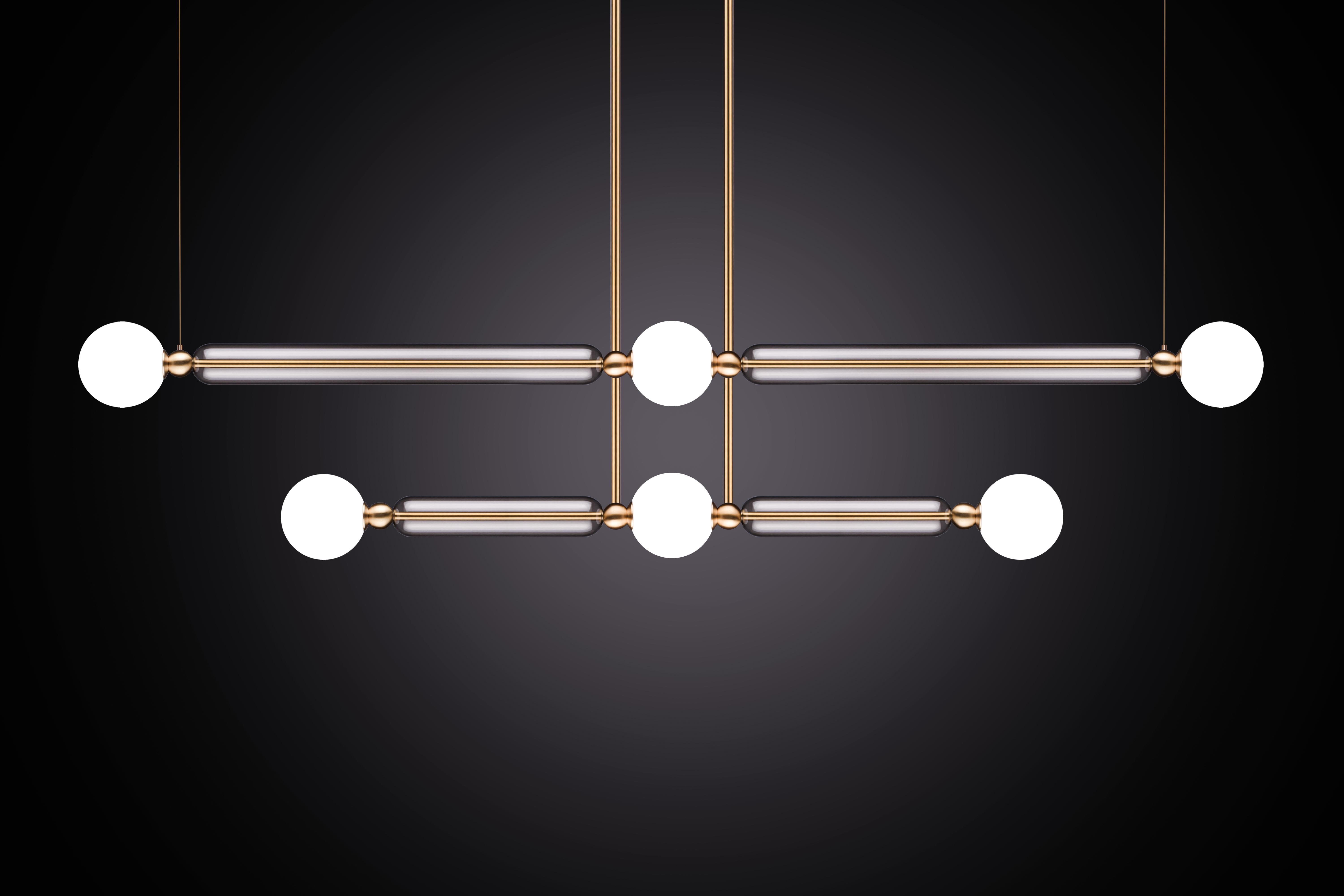 Case comprises of delicate brass arms encased in crystal glass tubes. All joined with solid brass sphere connectors to 
allow for multiple configurations and size options.