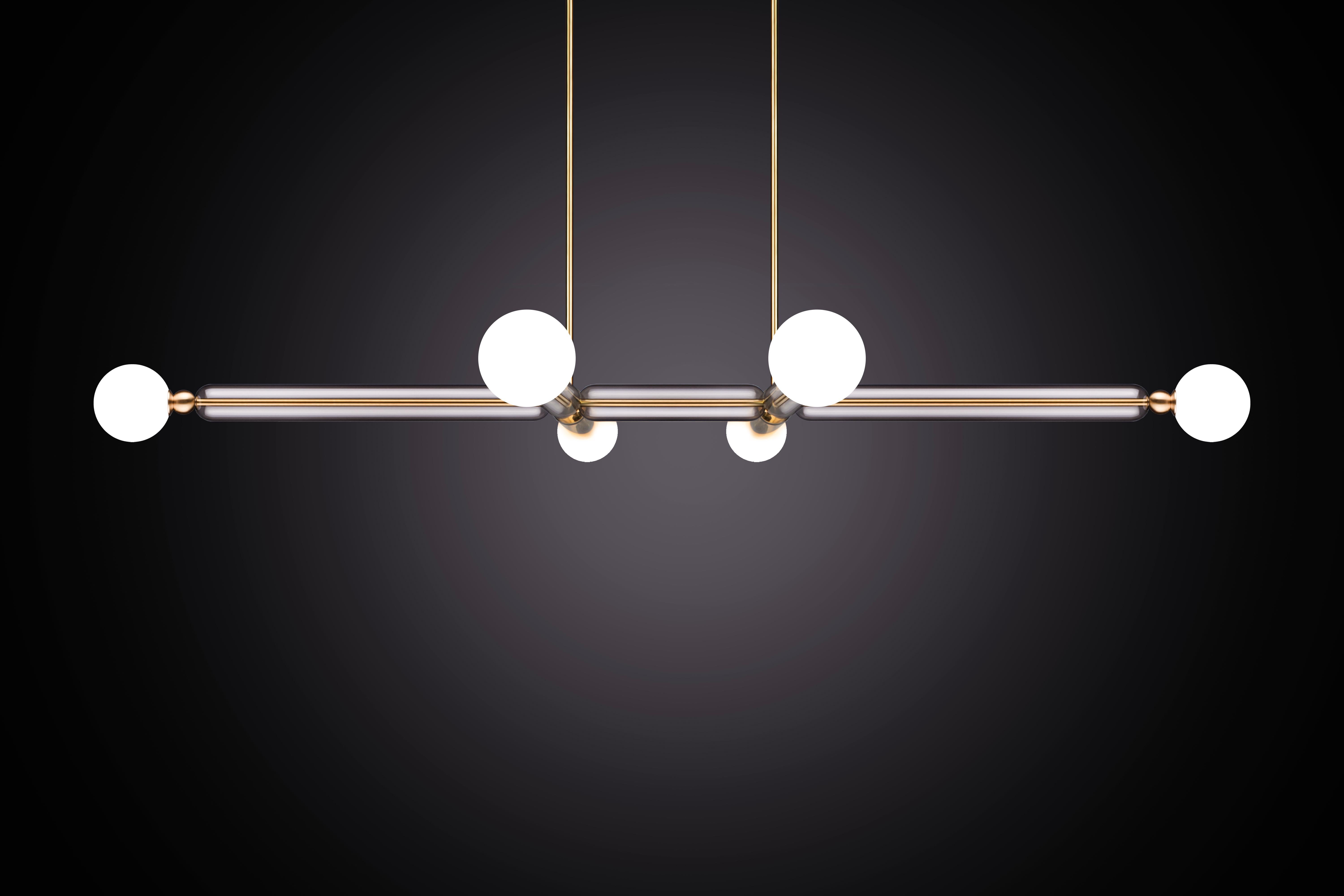 Case comprises of delicate brass arms encased in crystal glass tubes. All joined with solid brass sphere connectors to 
allow for multiple configurations and size options.