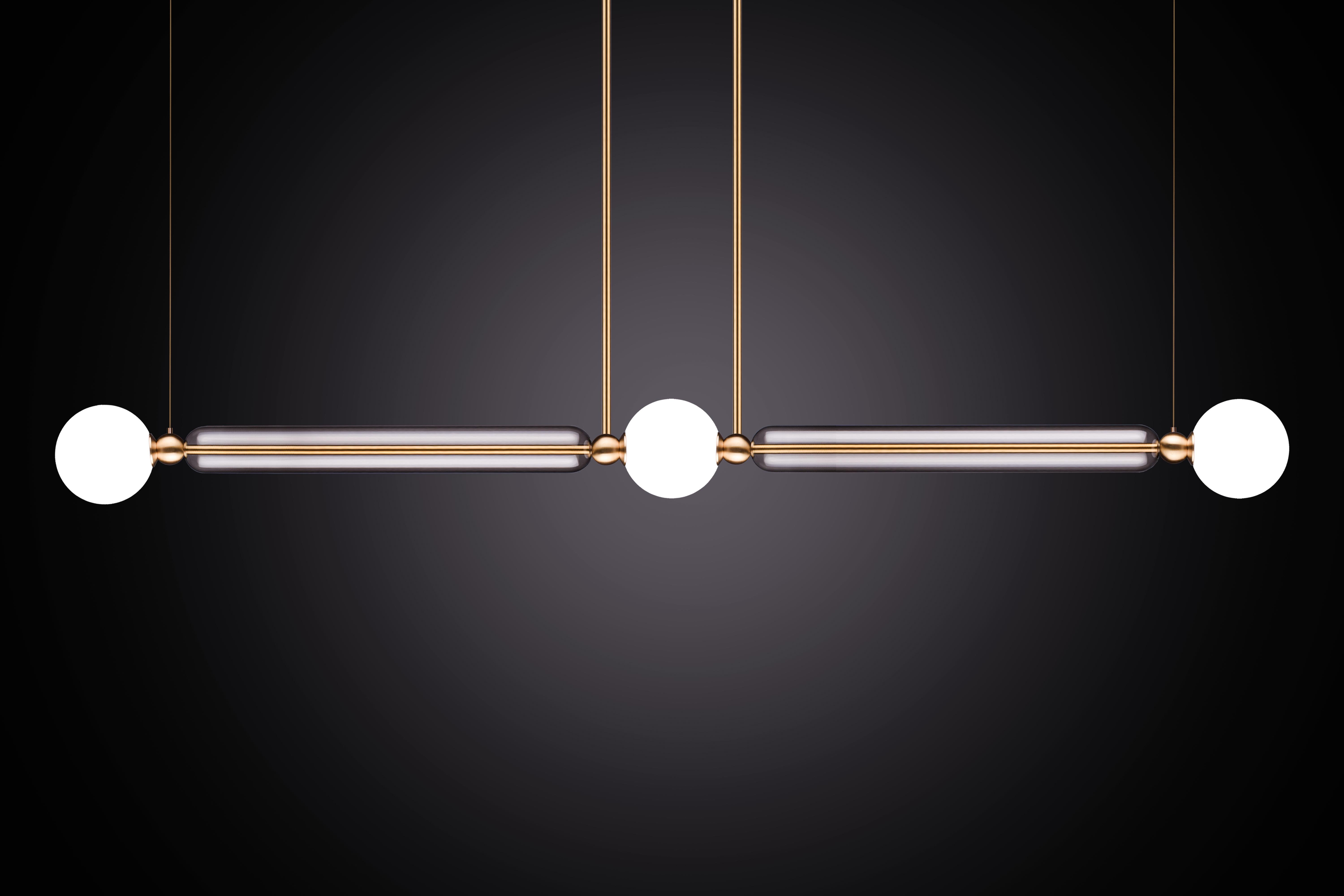 Case comprises of delicate brass arms encased in crystal glass tubes. All joined with solid brass sphere connectors to 
allow for multiple configurations and size options.