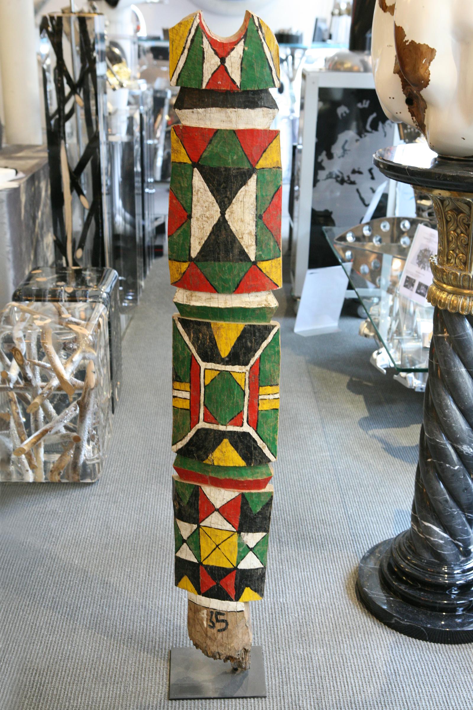 Sculpture Case Pillar B Polychrom from Rimaïbé
tribe, from north Burkina Faso, Africa. In hand painted
solid wood, circa 1975. On blackened steel base.
