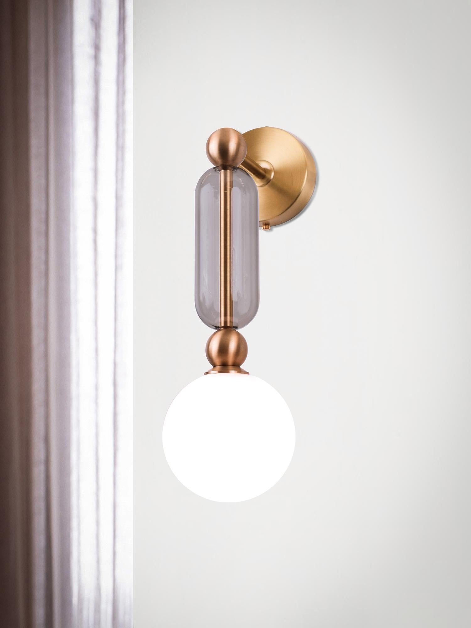 Case comprises of delicate brass arms encased in crystal glass tubes. All joined with solid brass sphere connectors to 
allow for multiple configurations and size options.