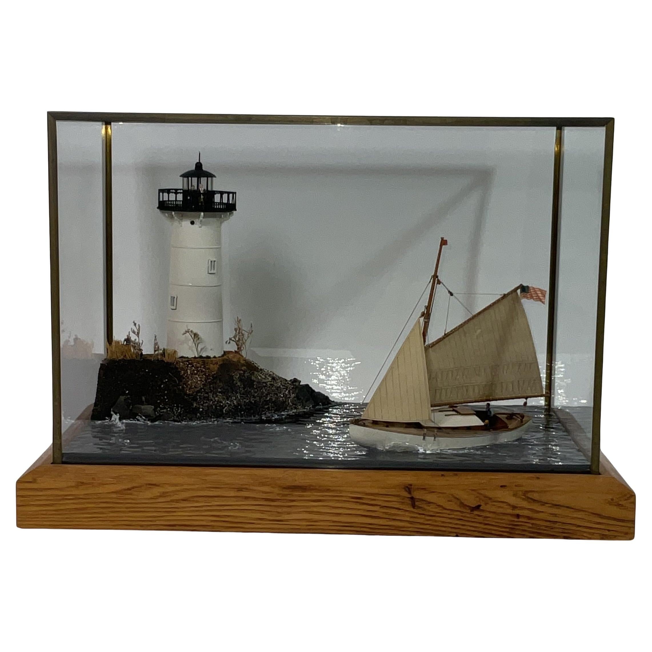 Cased Diorama of a Sloop Passing a Lighthouse
