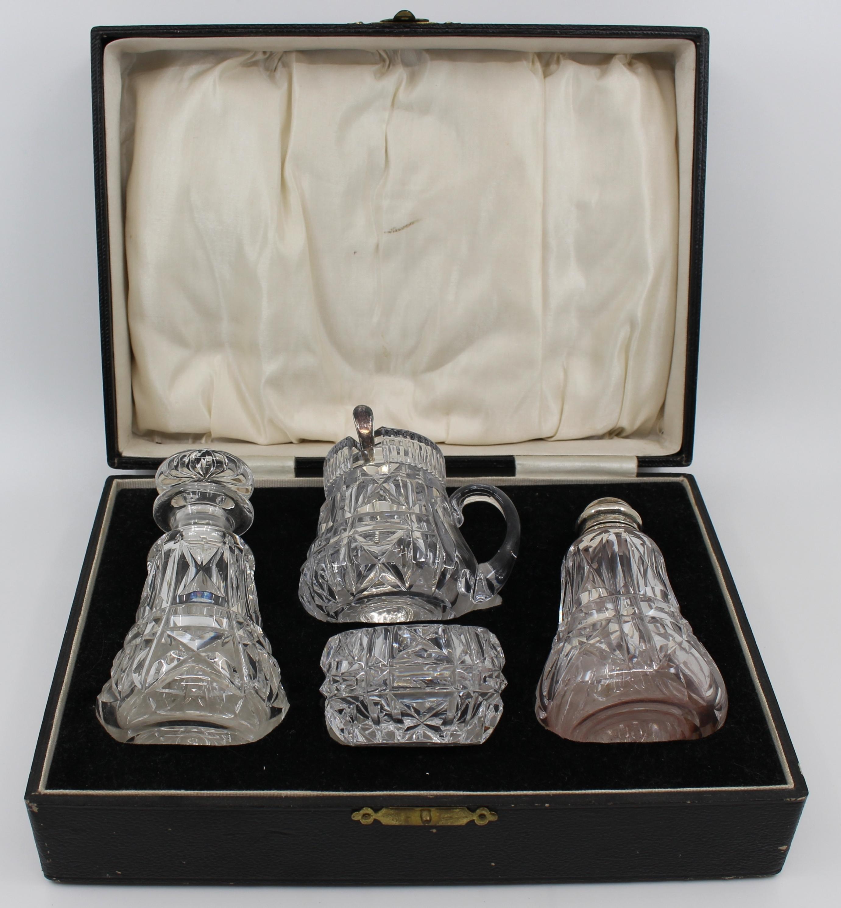 Cased John Walsh Crystal & Sterling Silver Cruet Set – Birmingham 1925

A superb early 20th-century English condiment service by John Walsh Crystal, complete with sterling silver mounts by E. Edmonds, fully hallmarked Birmingham 1925. The richly cut