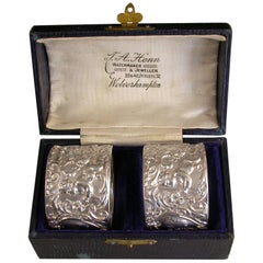 Cased Pair of Edwardian Silver Napkin Rings 
Cherubs
 by Walker 
Hall, 1904
