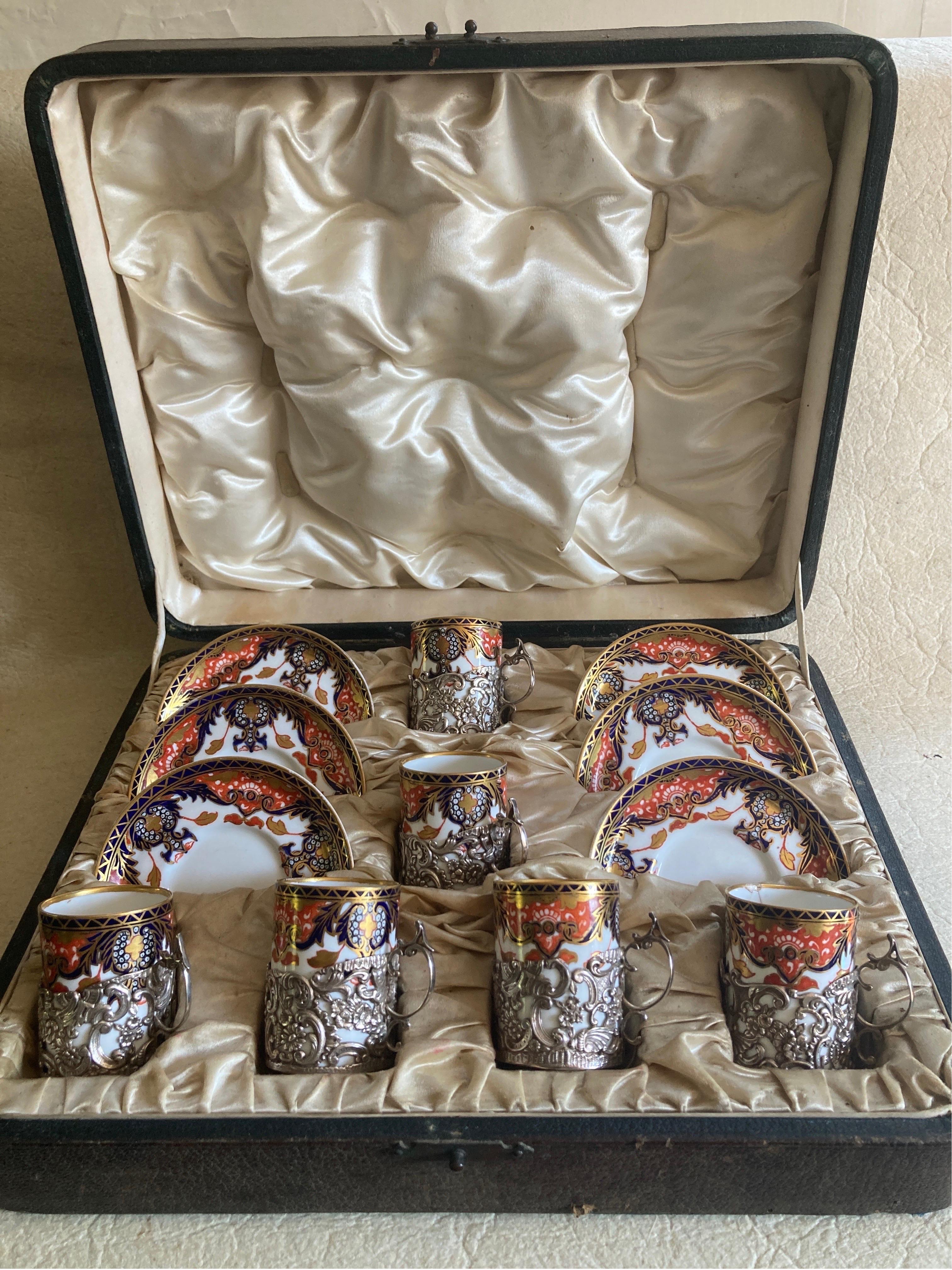 An exquisite Imari style collection of six silver holders with six cups & saucers, in great antique condition with no chips, cracks, crazing or restoration, no sign of wear on the silver holder and only ever used once. Circa 1920 (silver holders