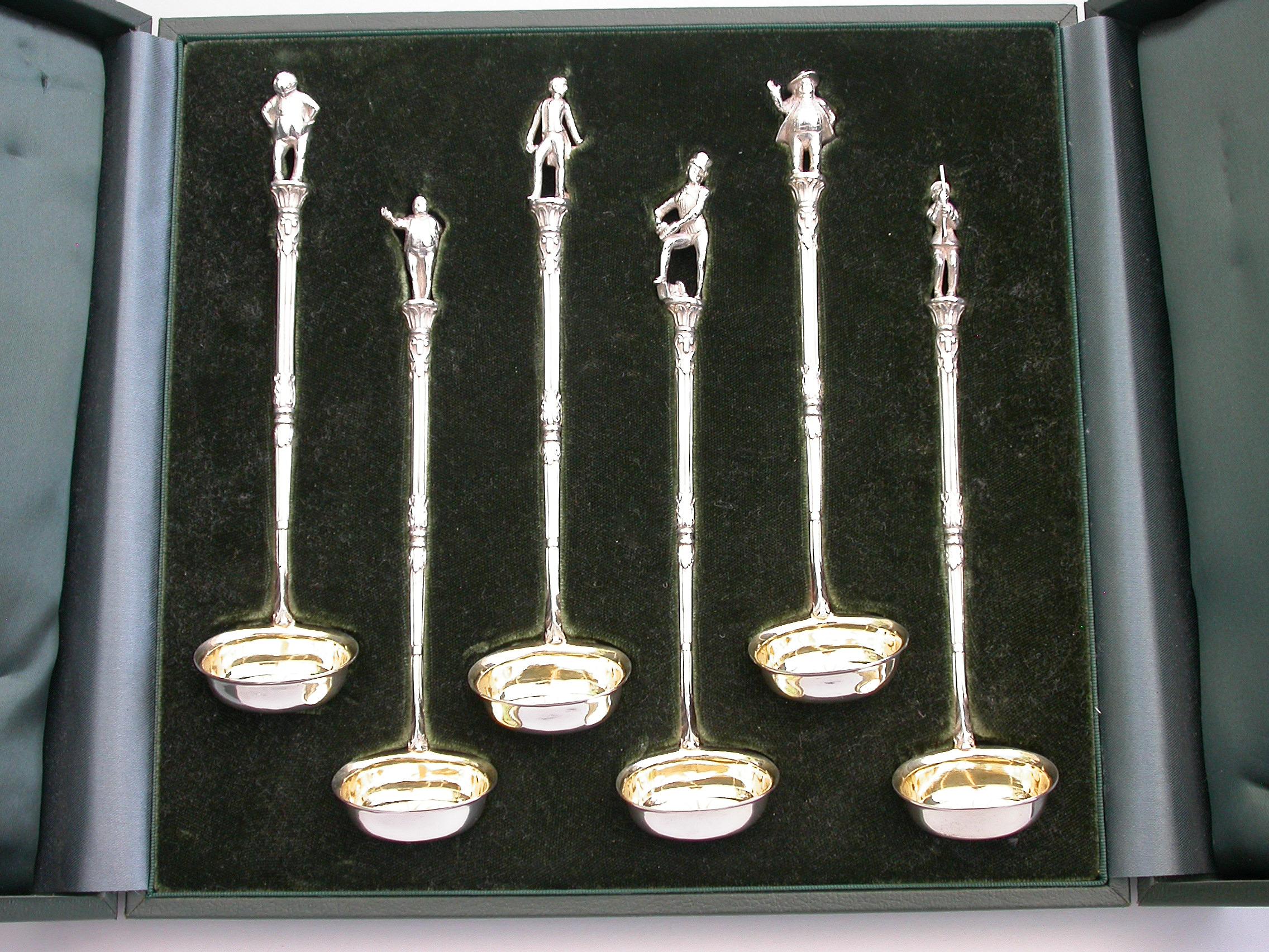 A rare and fine quality set of six novelty silver Toddy Ladles with silver gilt bowls, reeded column and acanthus leaf handles, the terminals formed as characters from Charles Dickens 'Pickwick Papers', namely;- Mr Pickwick, Sam Weller, Tony Weller,