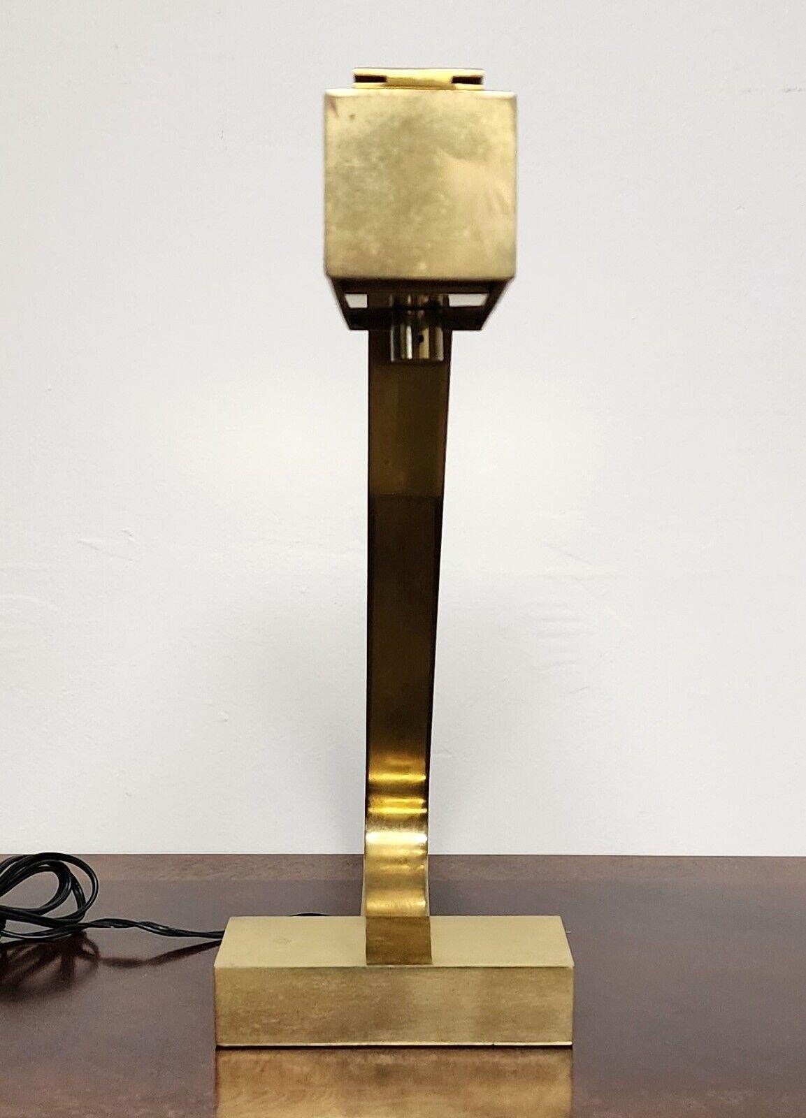 For FULL item description click on CONTINUE READING at the bottom of this page.

Offering One Of Our Recent Palm Beach Estate Fine Lighting Acquisitions Of A
1970s Rare MCM Casella Brass Flat Bar Desk Lamp 

Approximate Measurements in Inches
15.75
