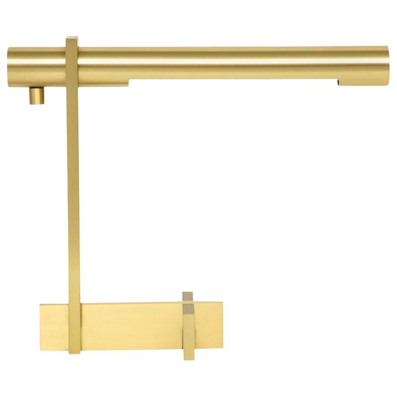 Casella desk lamp, brushed brass, cantilevered signed. Casella Model C1155. Medium scale desk lamp with a hard edge design, cruciform base, and brushed brass finish. The shade rotates and the lamp has a dimmer switch. There are two labels on the