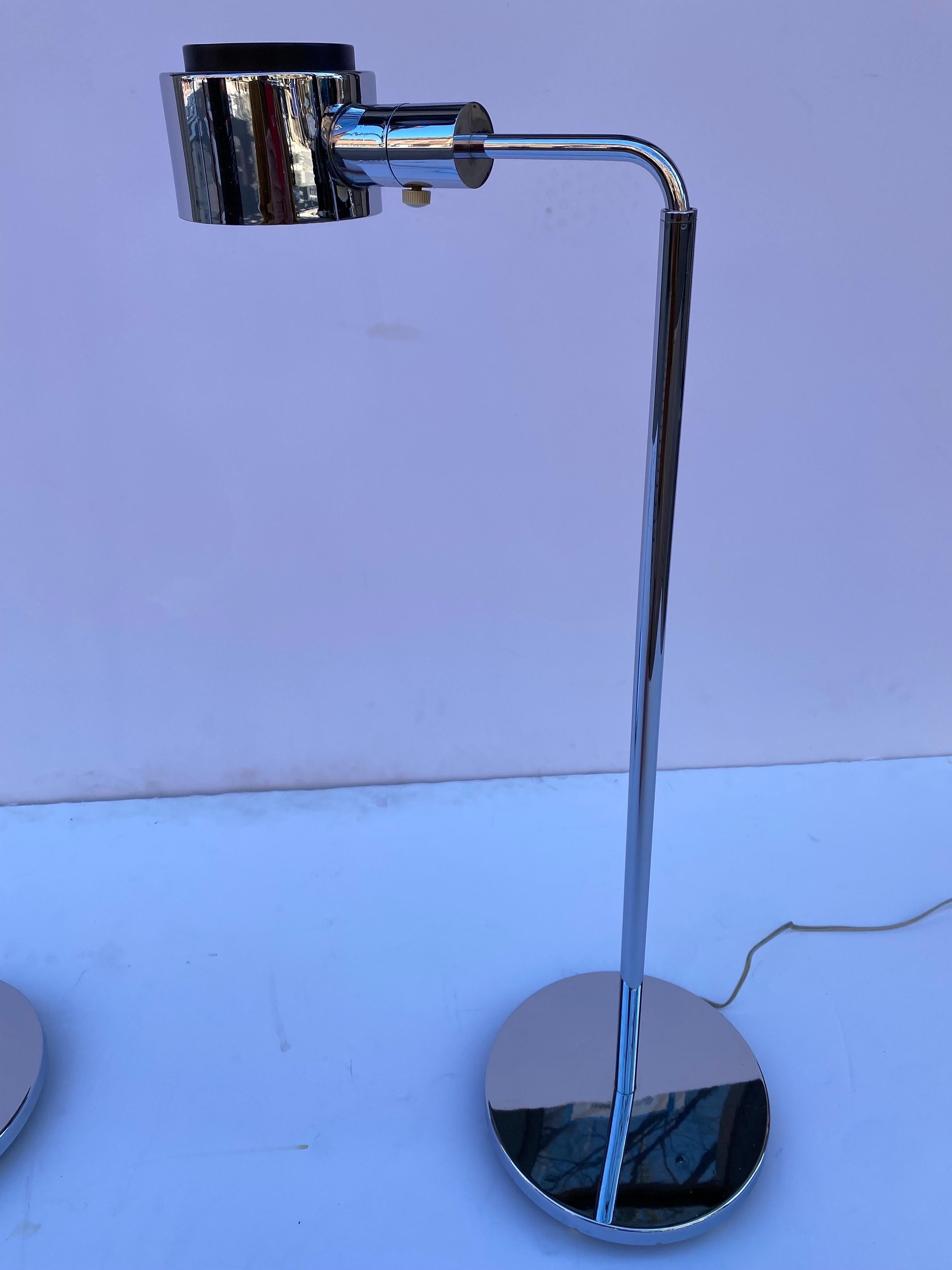 Pair of Casella chrome floor lamps that adjust from roughly 33