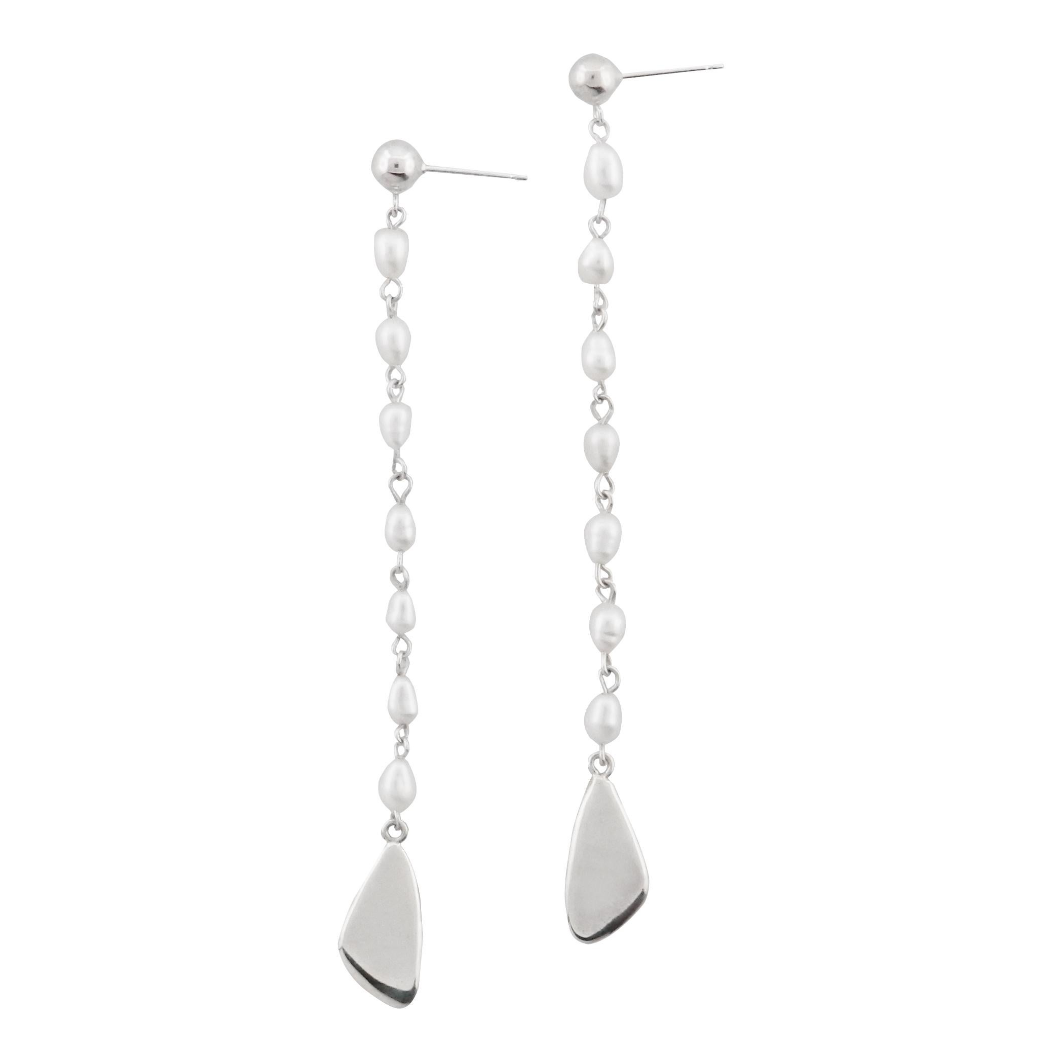 The Sway earrings are named for their graceful sway, exuding playful femininity and movement. A delicate chain of freshwater pearls gracefully suspends a petal-shaped charm that dances with every step.

Sterling Silver

Sterling silver posts and