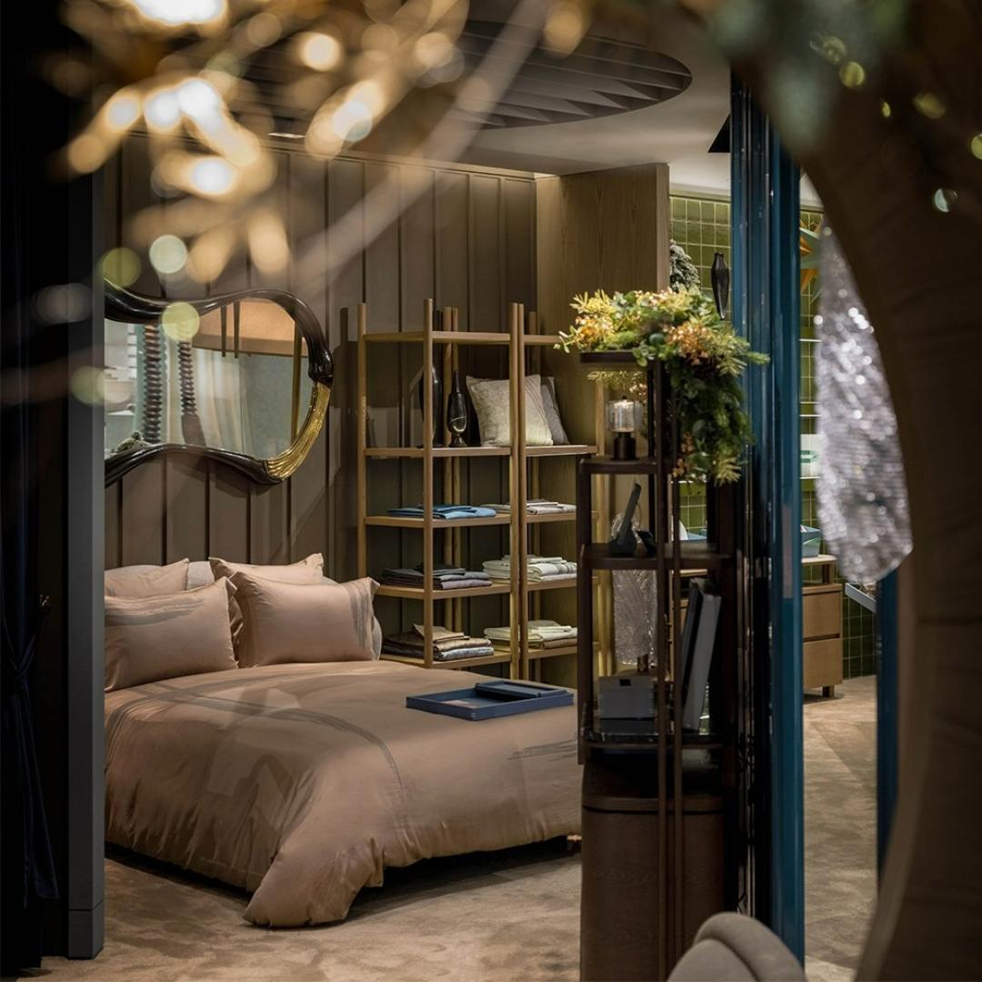 a sculptural hand-made bed that evoked the organic silhouette of a cashew nut, upholstered in a selection of soft boucle and curated fabrics. it evokes the feeling of being nestled in a personal cocoon, an environment that exudes comfort and a sense