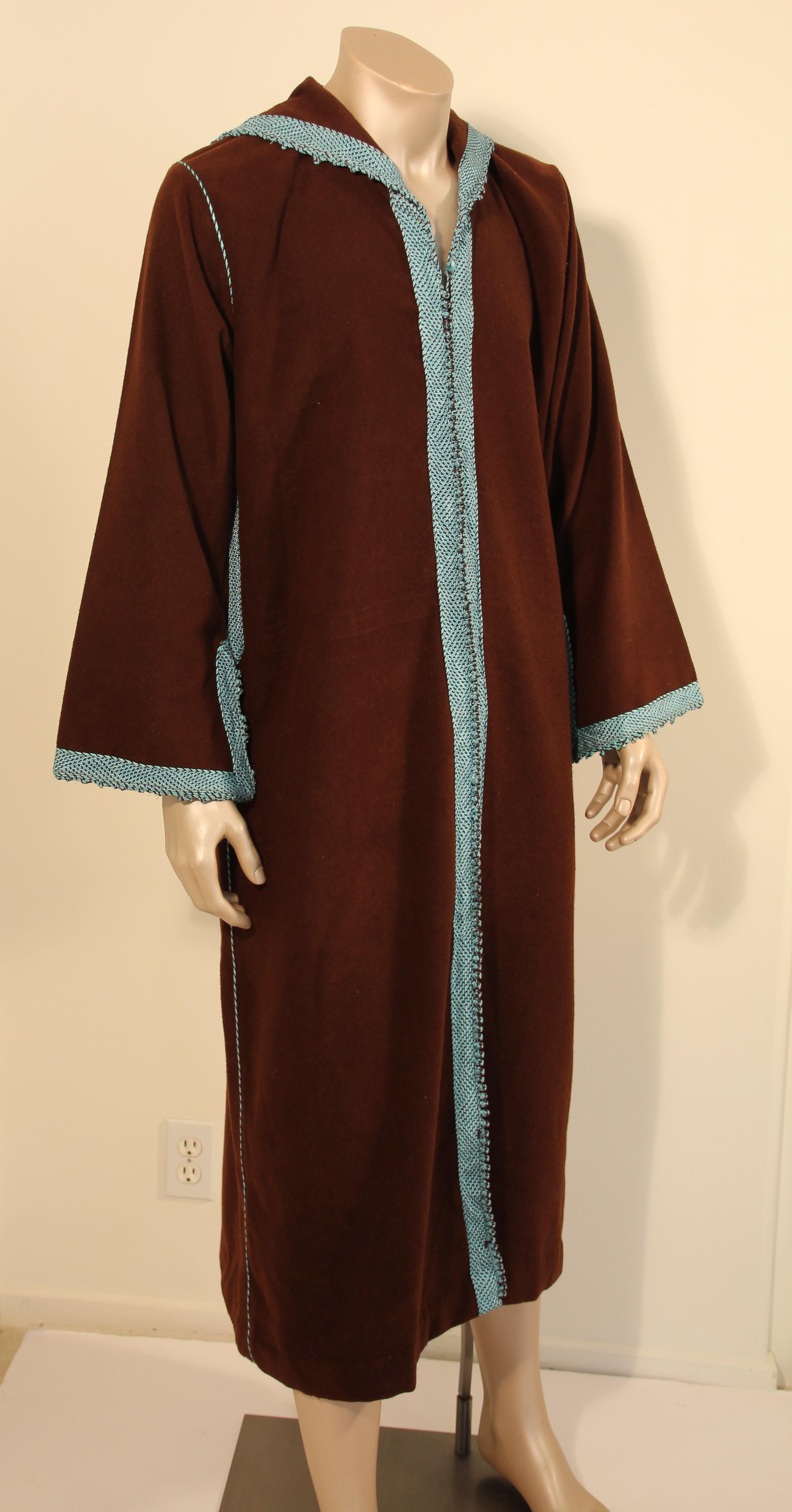 Handmade Moorish cashmere brown and turquoise long maxi dress caftan from North Africa, Morocco.
Vintage 1980s caftan robe.
Caftan with running down the center round braided buttons from the neckline to the hemline.
Fully front thread buttoning with