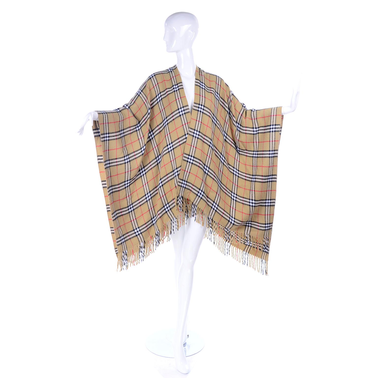This is a fabulous vintage Burberry cashmere blend cape / poncho that is so easy to wear and so soft!  Not a classic poncho because the front is open, so we really call it more of a cape. The cape is similar to the modern Collette Cape, this has the