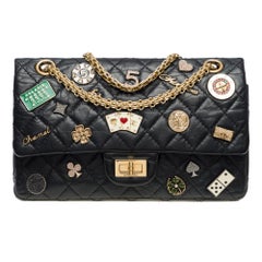 Casino Charms 2.55 Chanel double flap shoulder bag in black leather, AGHW
