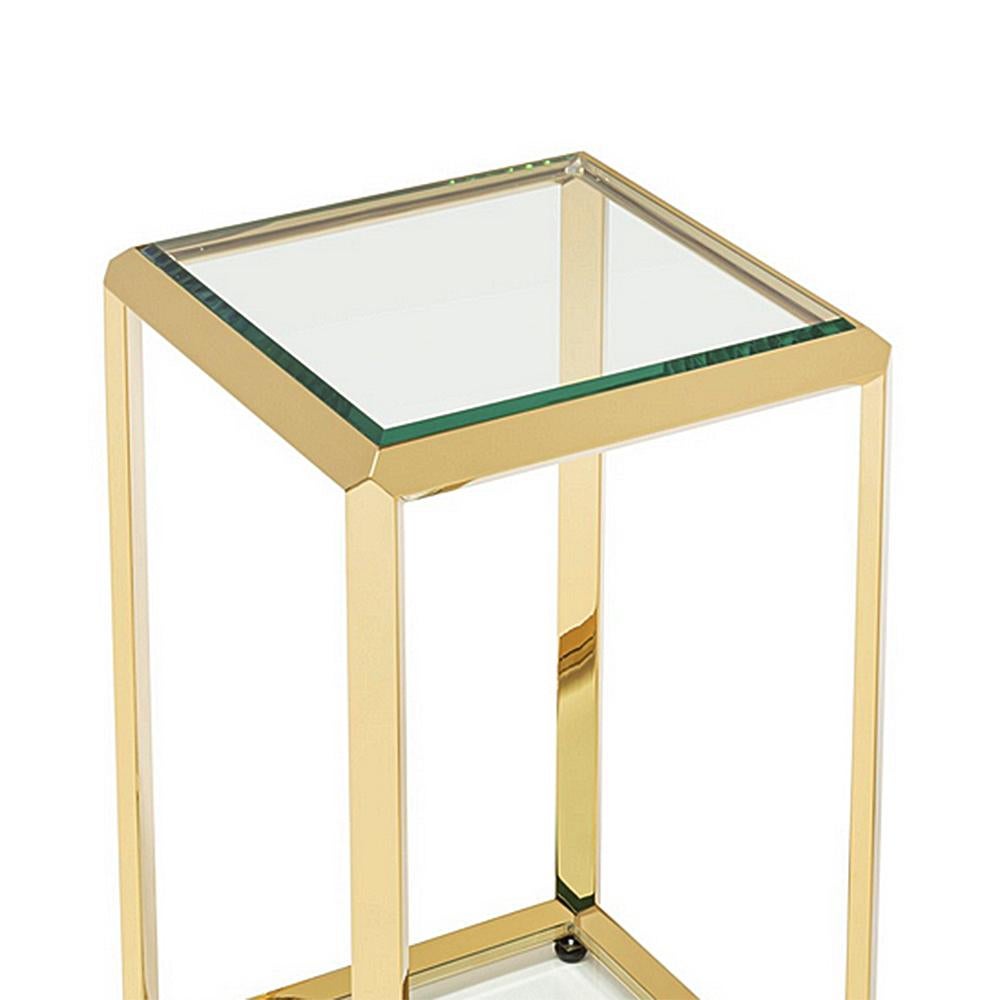 Casiopee Gold Low Side Table with steel structure
in gold finish, with up and down tops in bevelled 
clear glass.