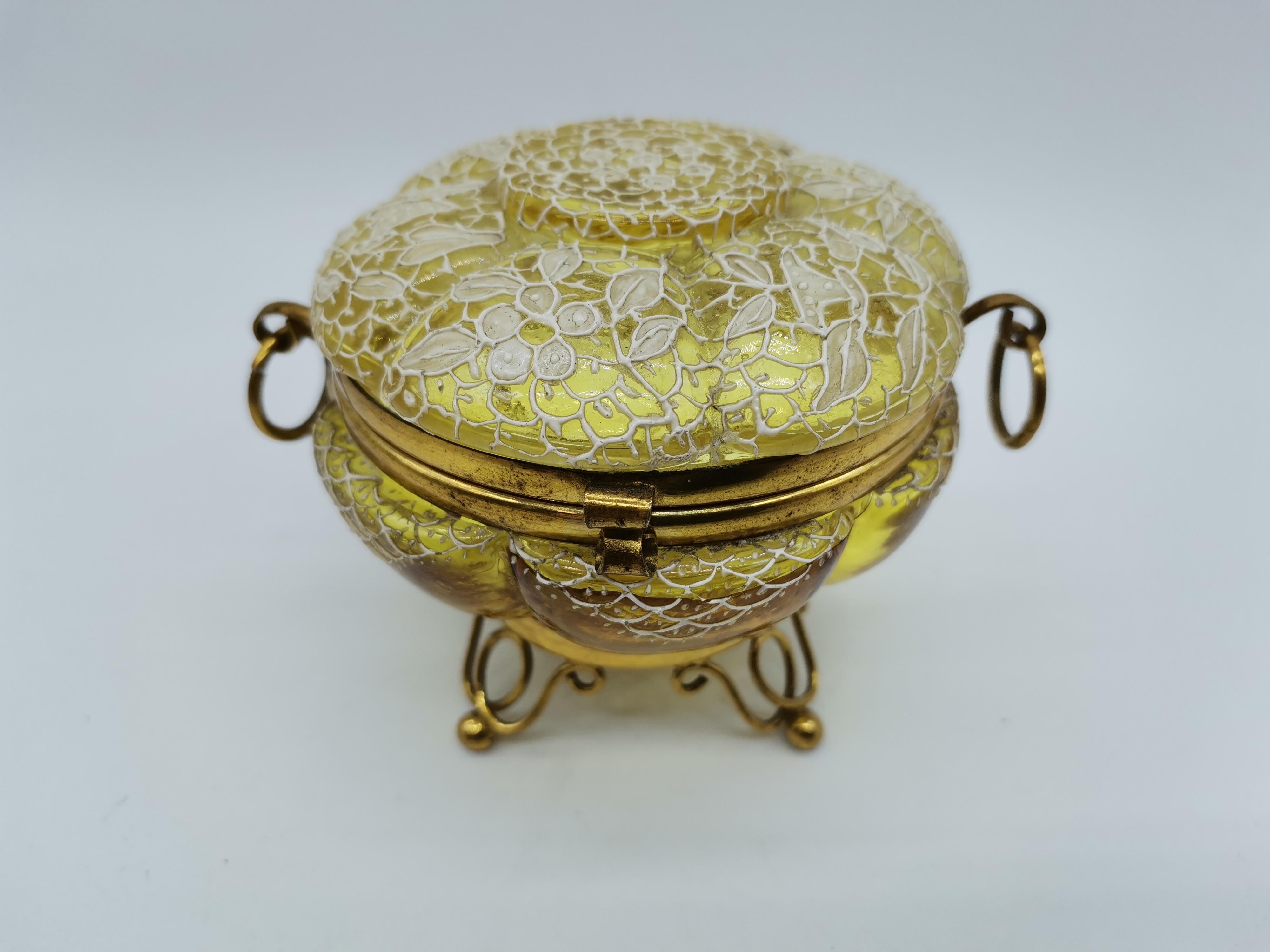 A small casket for jewelery made of glass and brass in Venice.