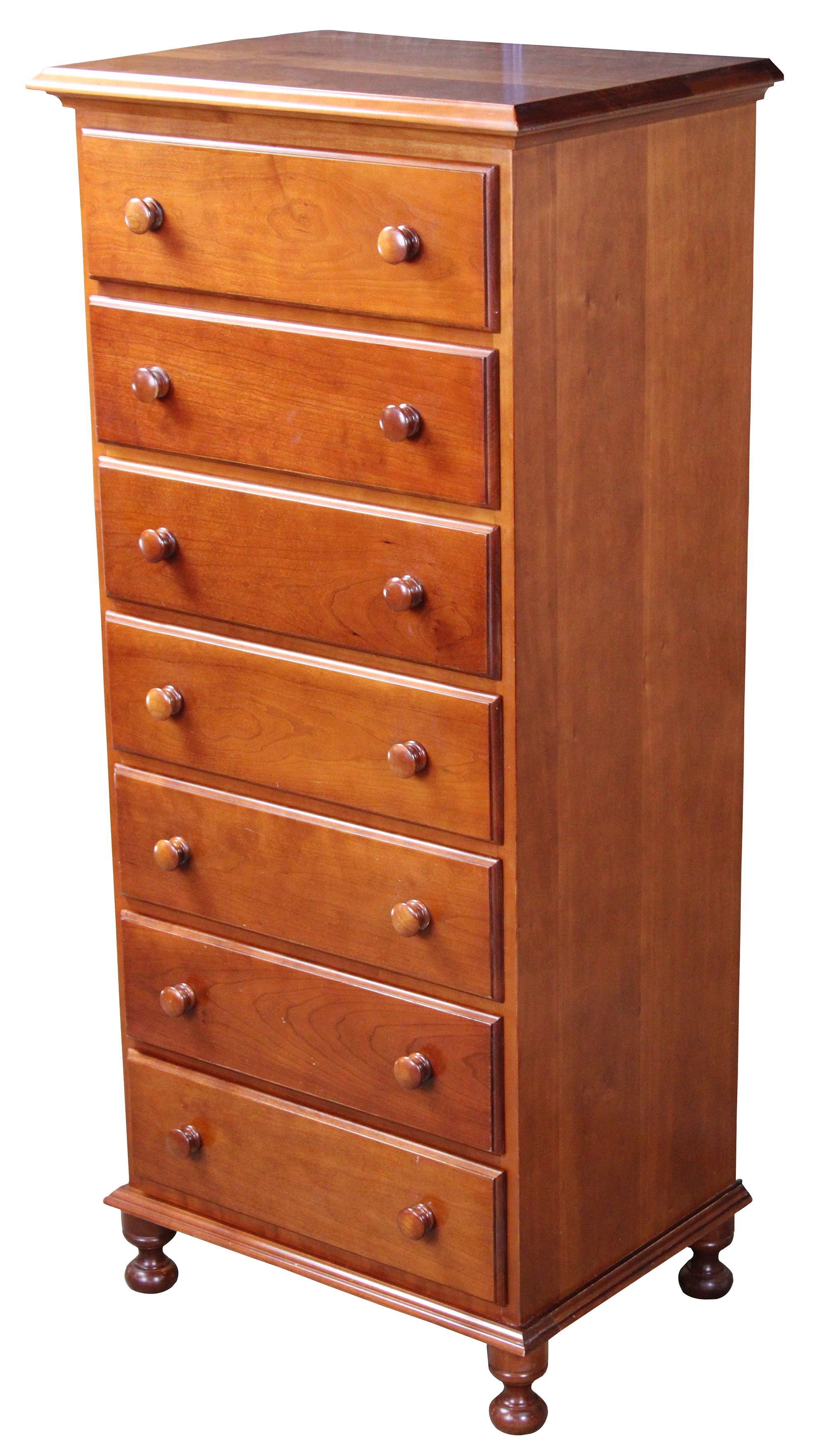 Vintage Cassady Furniture Co solid cherry semainier chest. An early American reproduction featuring seven dovetailed drawers and bun feet. Cassady Furniture is out of Bowling Green Kentucky, circa 1980s.
       