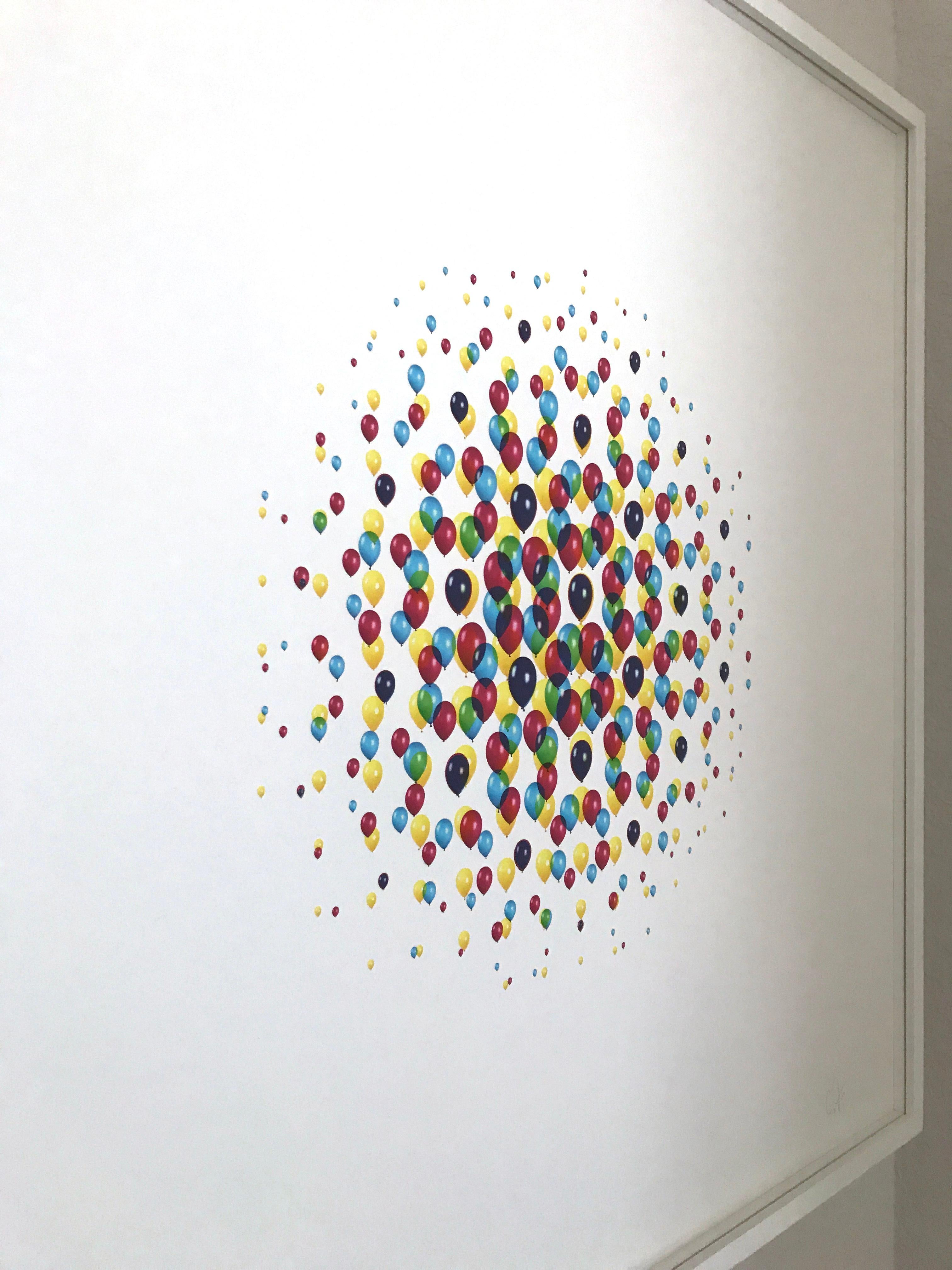 See Me From Afar is a contemporary archival inkjet print by artist Cassandra C. Jones. This print shows a collage of colorful balloons, varying in size and color, that gradually disappear into the stark white background of the piece. This circular