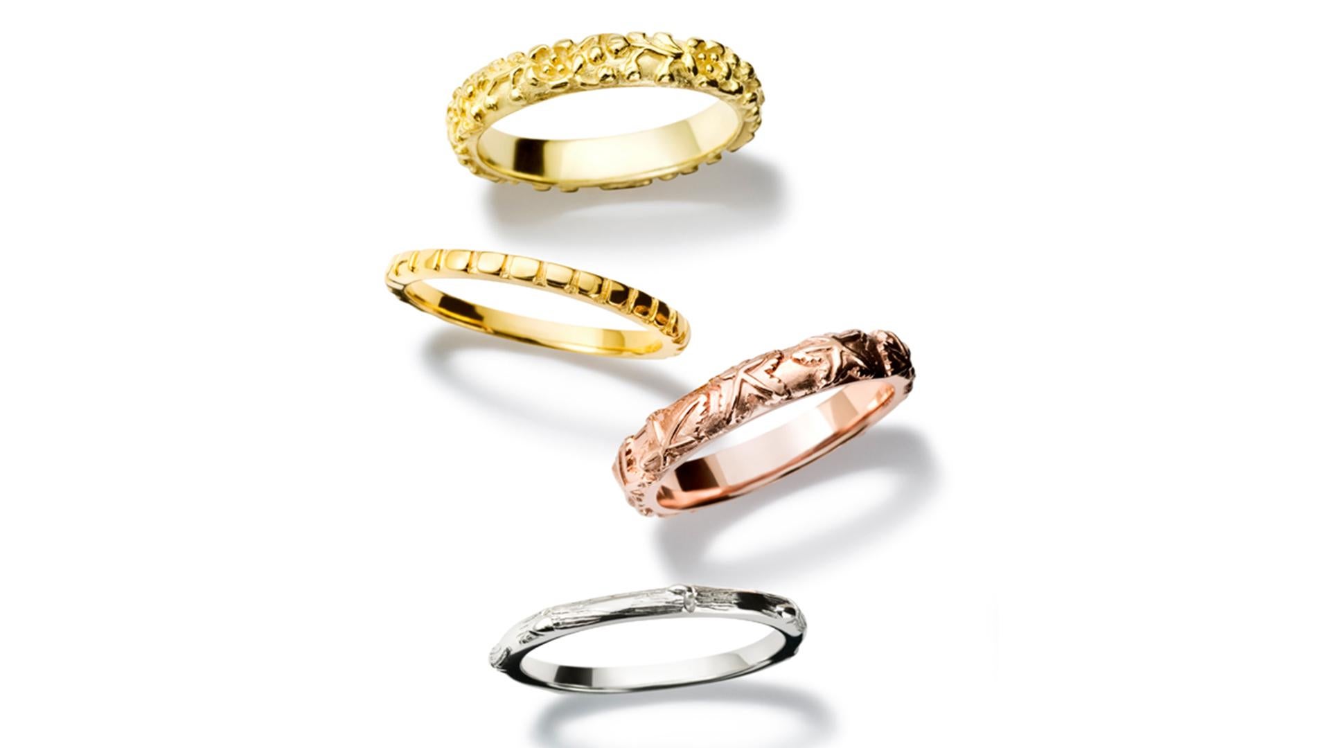 Four Seasons stack ring in 18 carat yellow, white, rose gold. Inspired by the traditional Japanese themes for the Four Seasons : with Spring symbolized by Plum blossom, Chrysanthemum flowers for Summer, Maple leaves for Autumn & Bamboo for Winter.